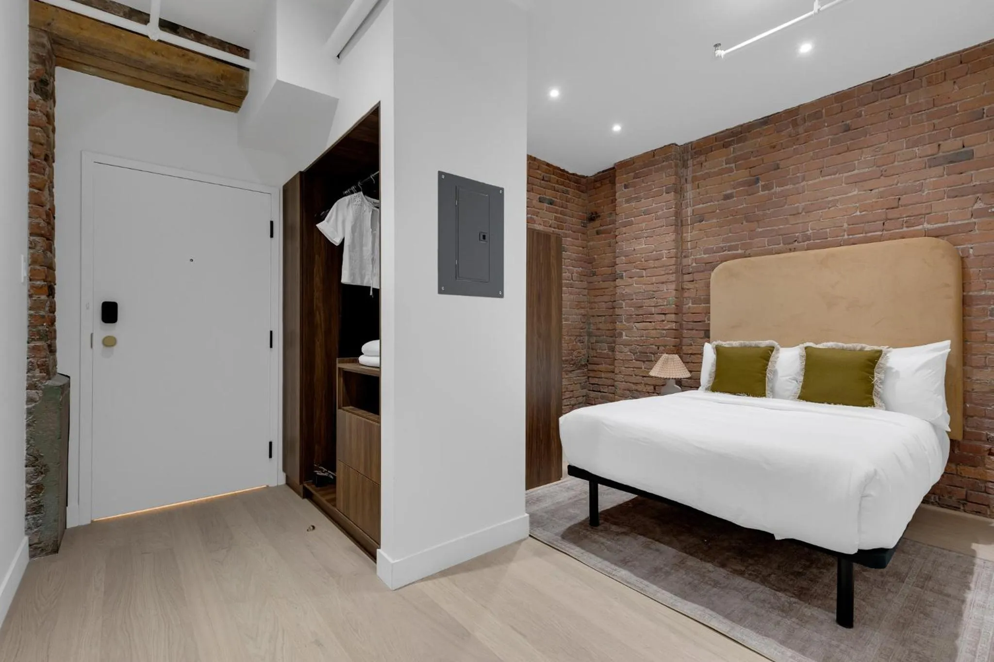 Bed in The Mercer Boutique Hotel