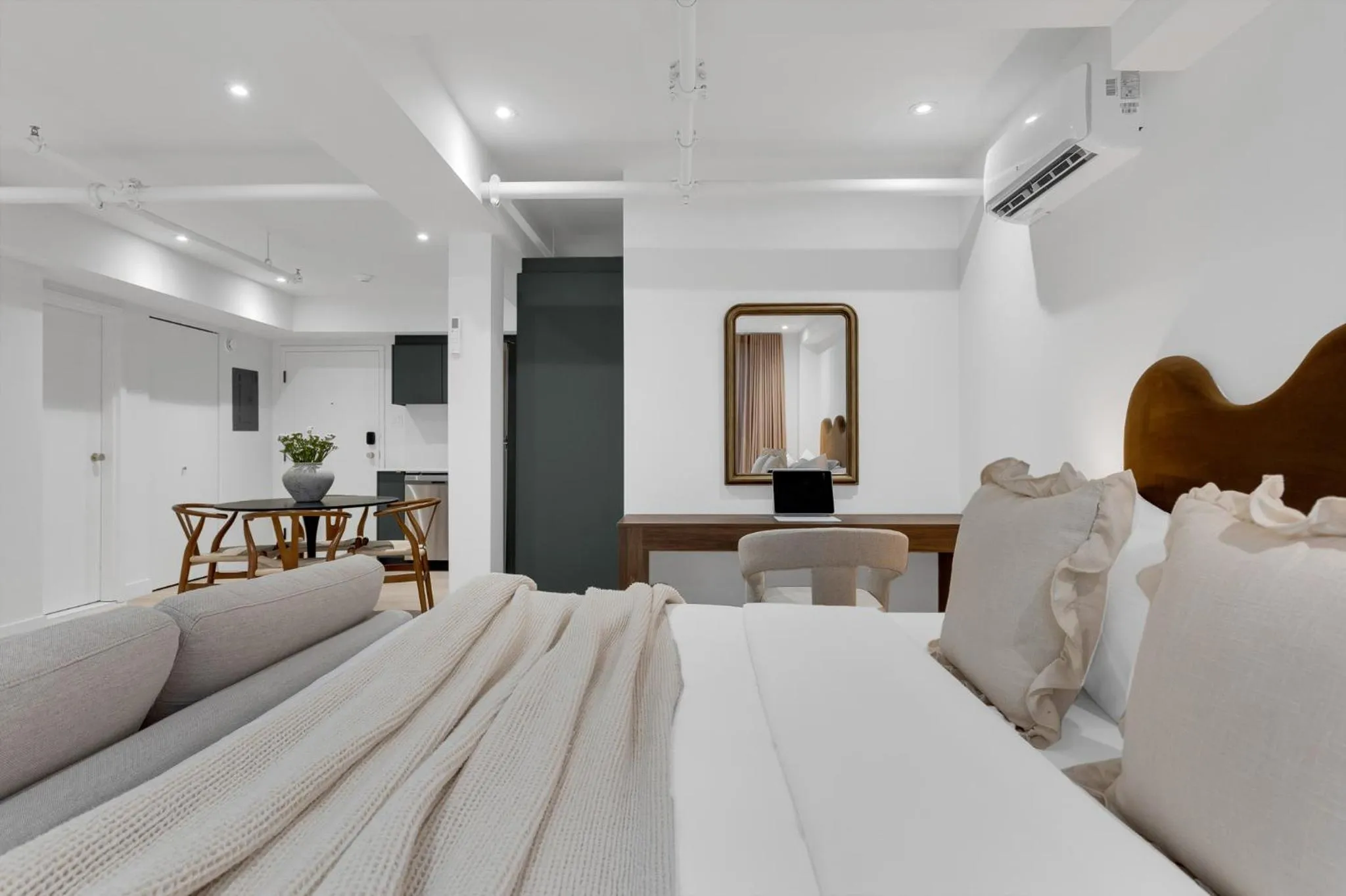 Bed in The Mercer Boutique Hotel