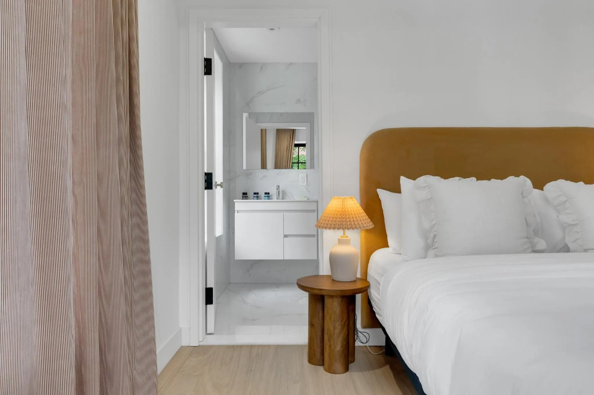 Bed in The Mercer Boutique Hotel