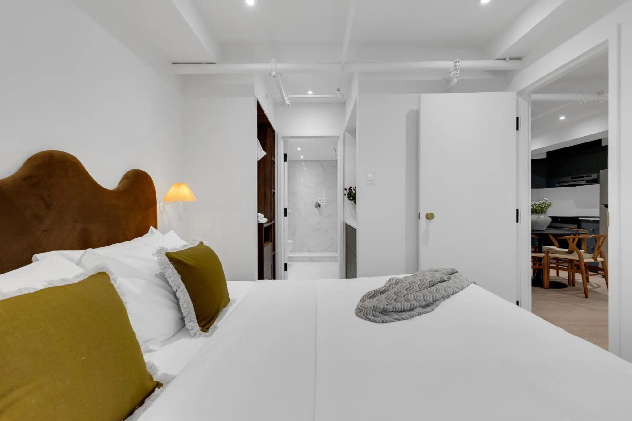 Bed in The Mercer Boutique Hotel