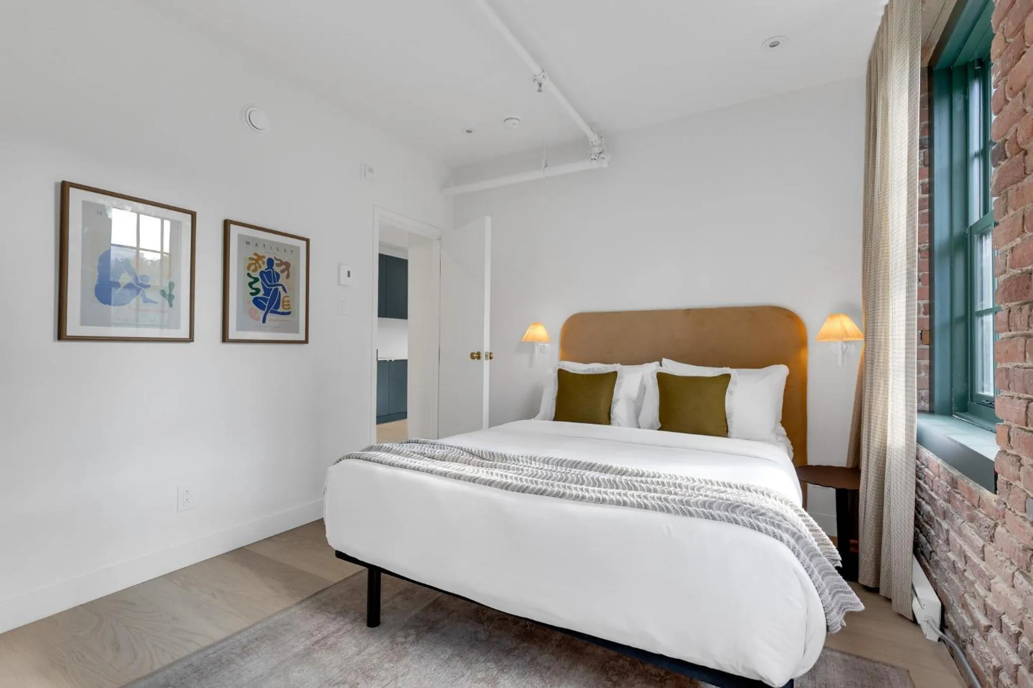 Bed in The Mercer Boutique Hotel