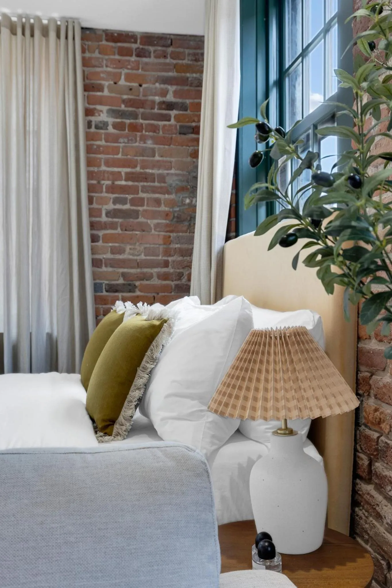 Bed in The Mercer Boutique Hotel