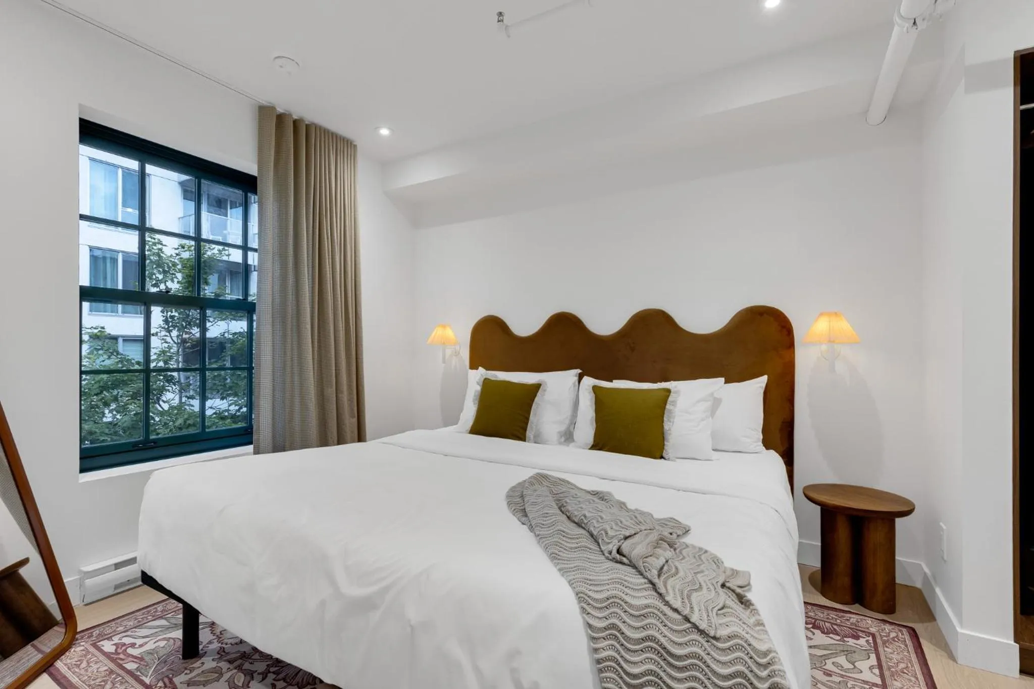 Bed in The Mercer Boutique Hotel