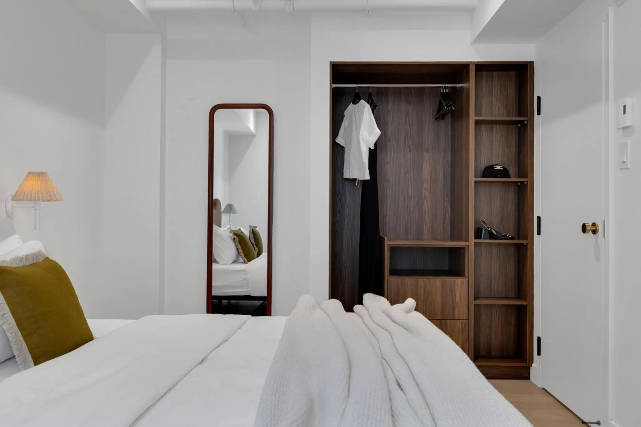 Bed in The Mercer Boutique Hotel