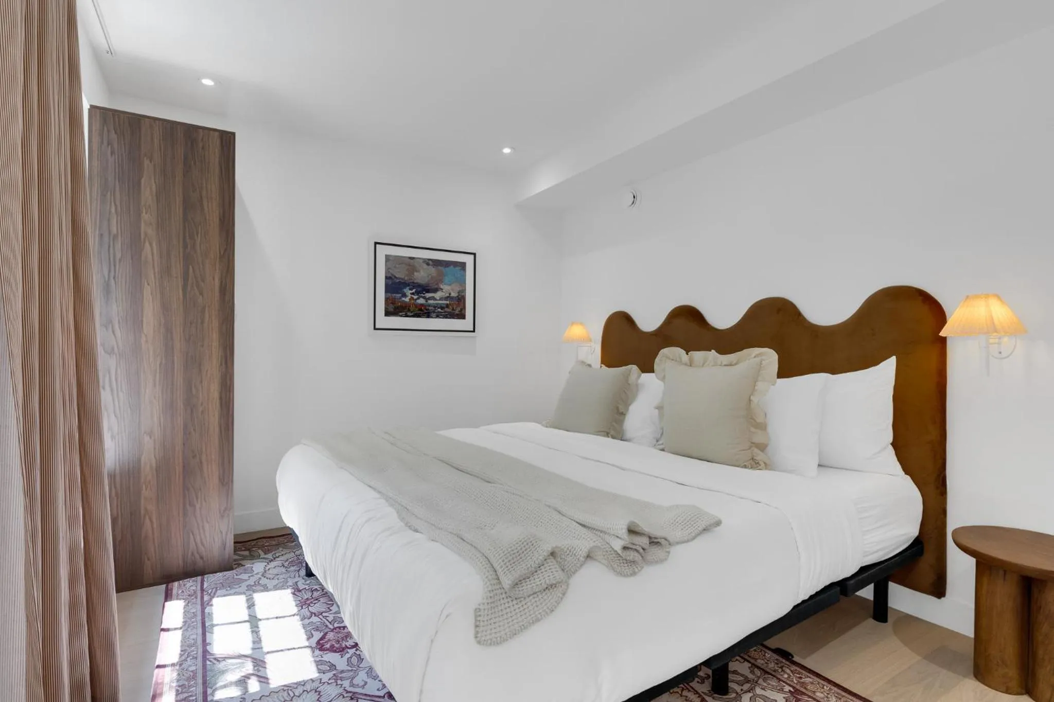 Bed in The Mercer Boutique Hotel