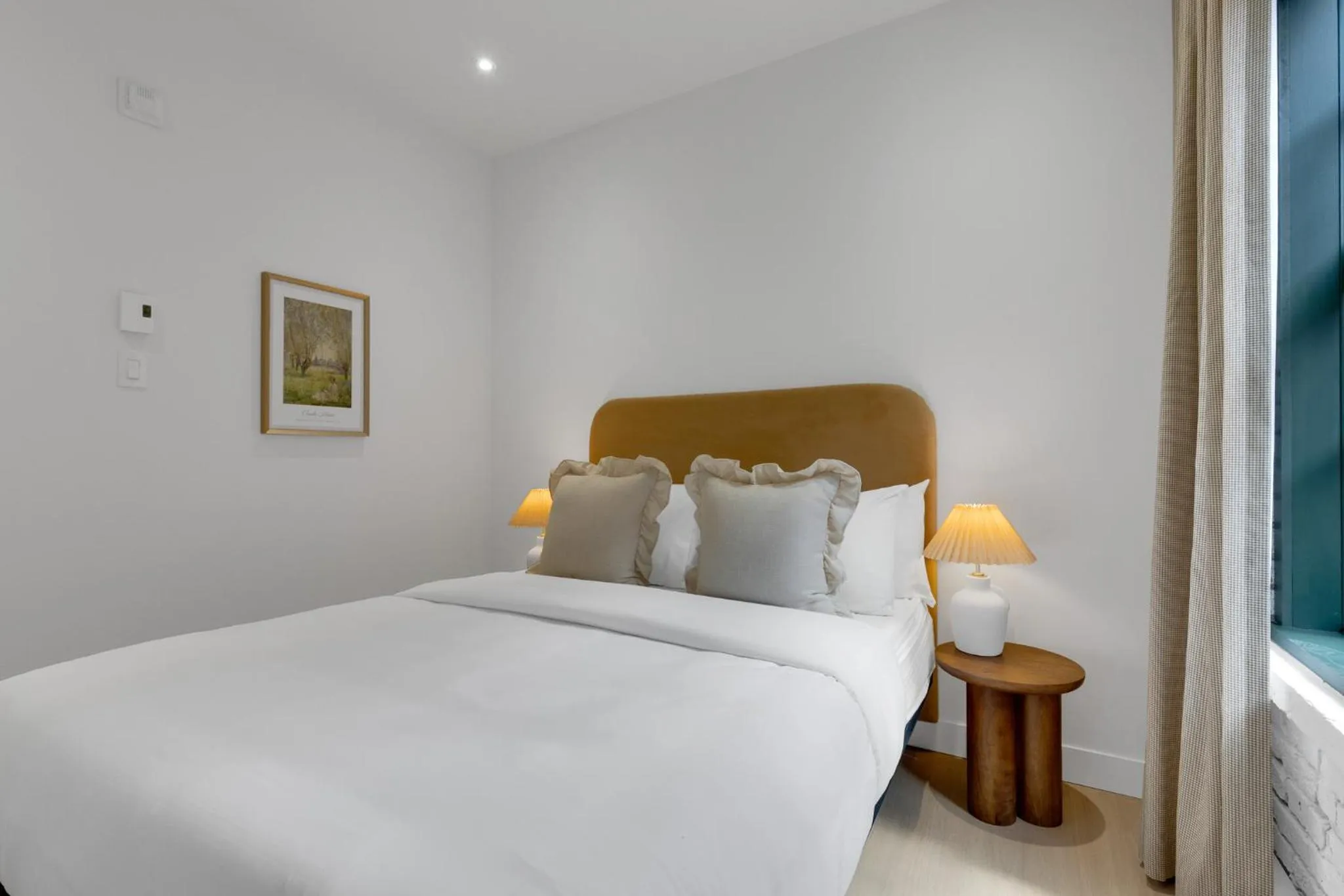 Bed in The Mercer Boutique Hotel