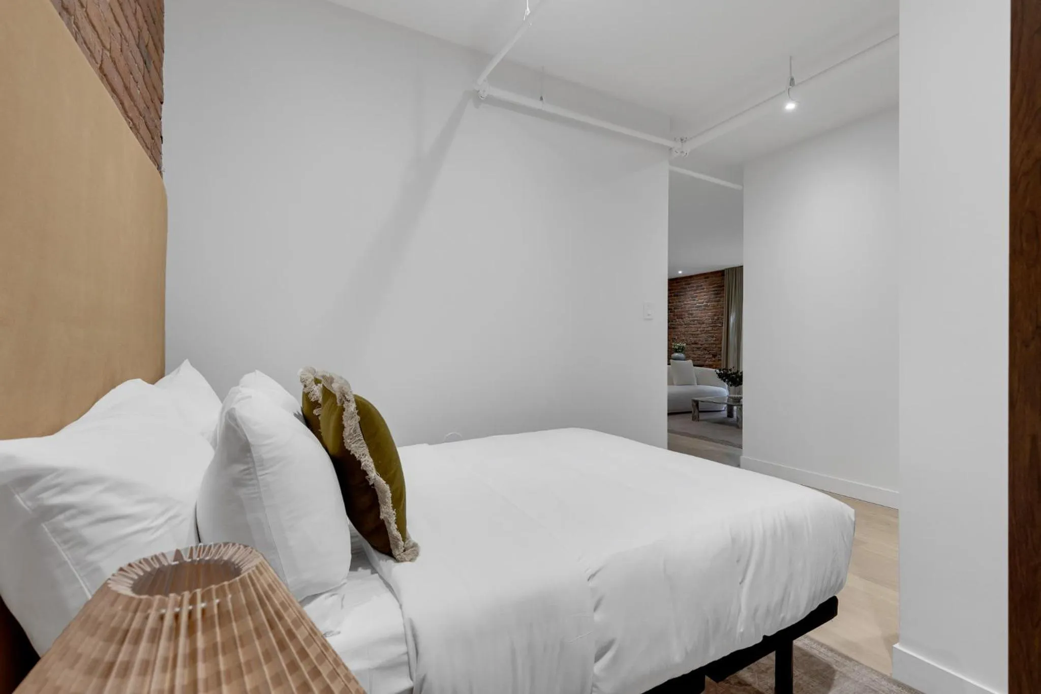 Bed in The Mercer Boutique Hotel