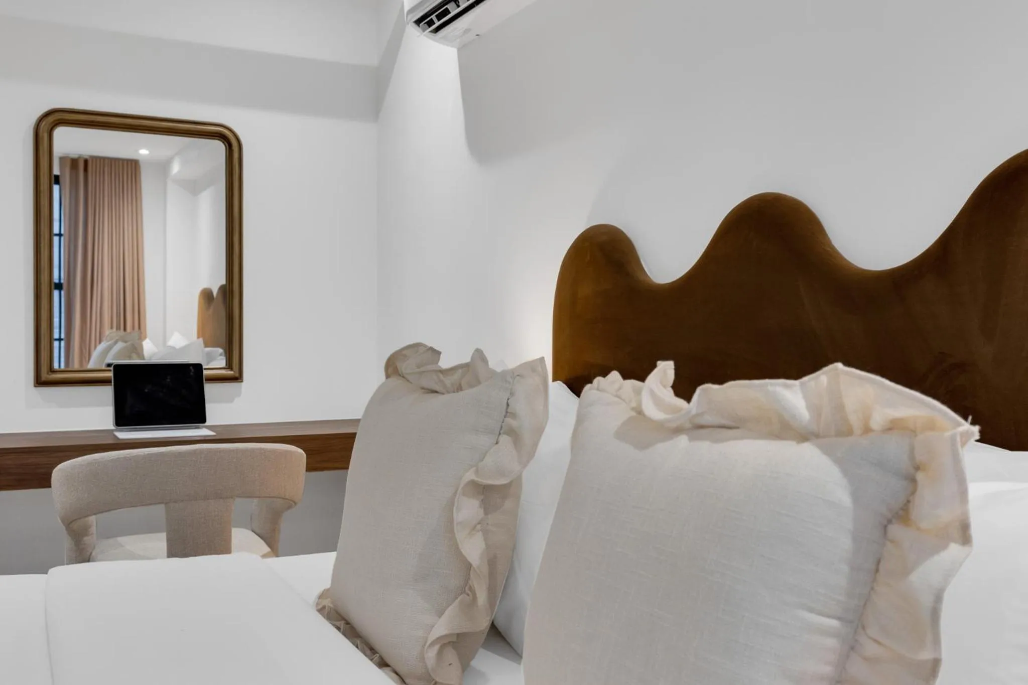 Bed in The Mercer Boutique Hotel