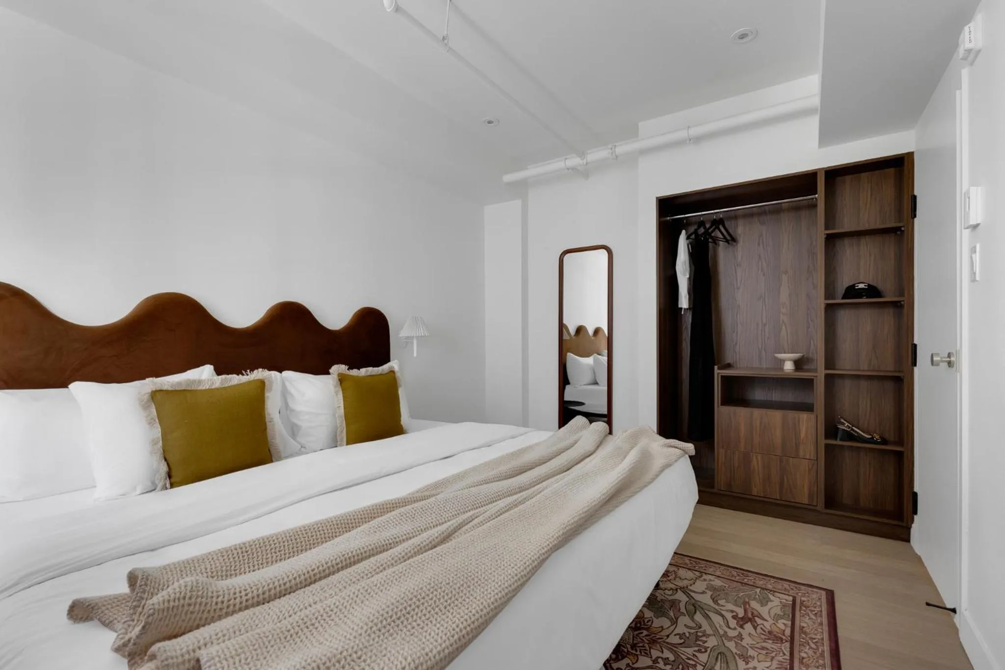 Bed in The Mercer Boutique Hotel