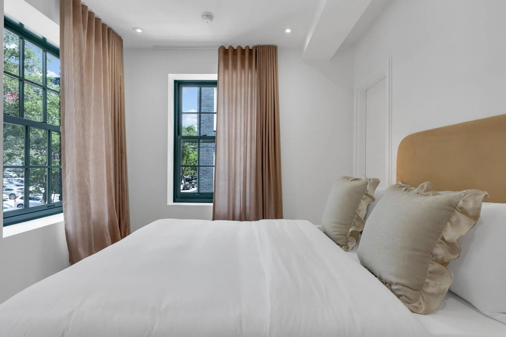 Bed in The Mercer Boutique Hotel