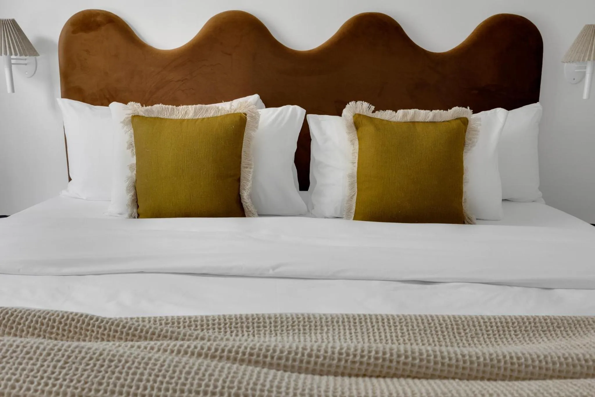 Bed in The Mercer Boutique Hotel