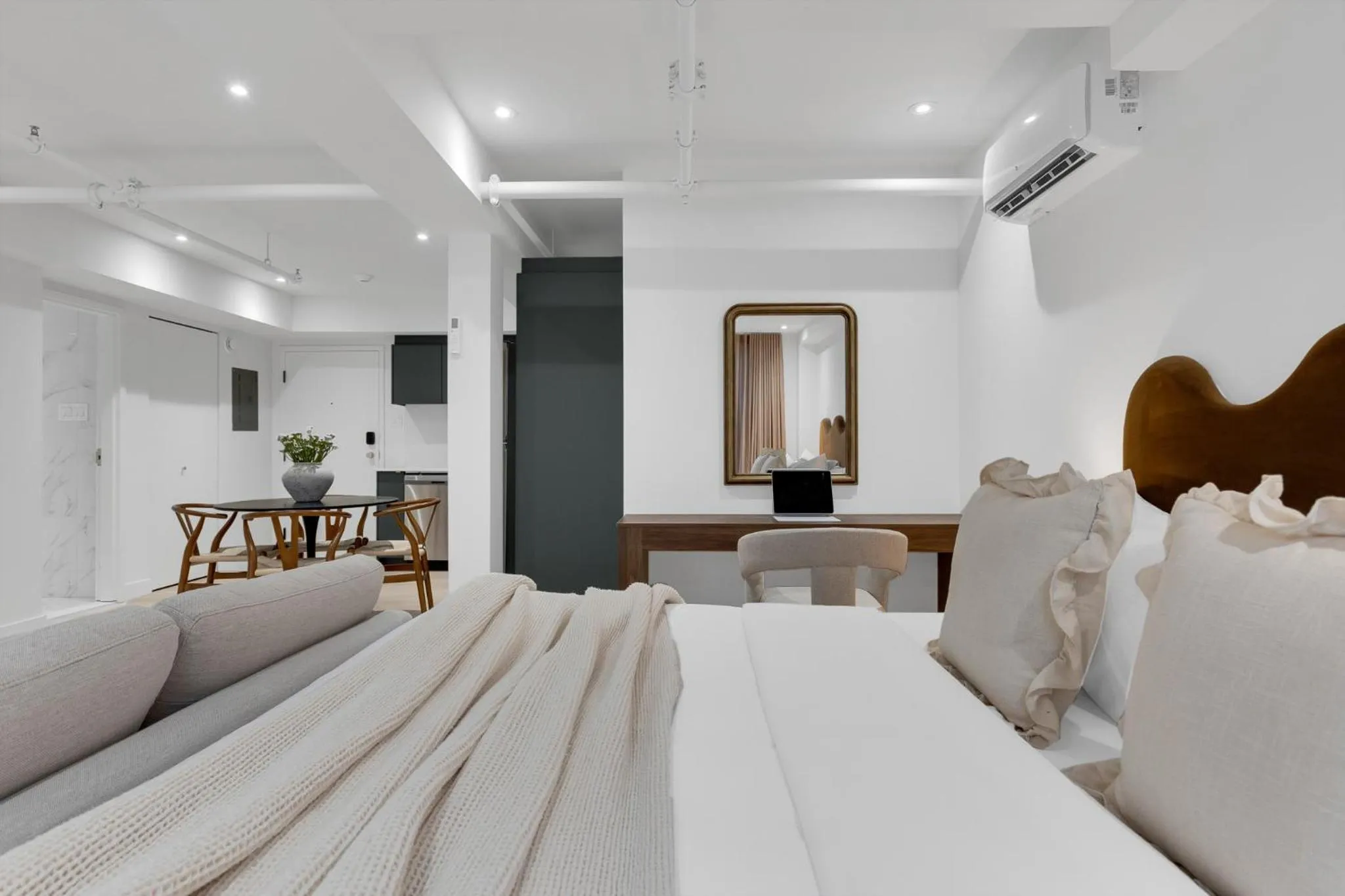 Bed in The Mercer Boutique Hotel