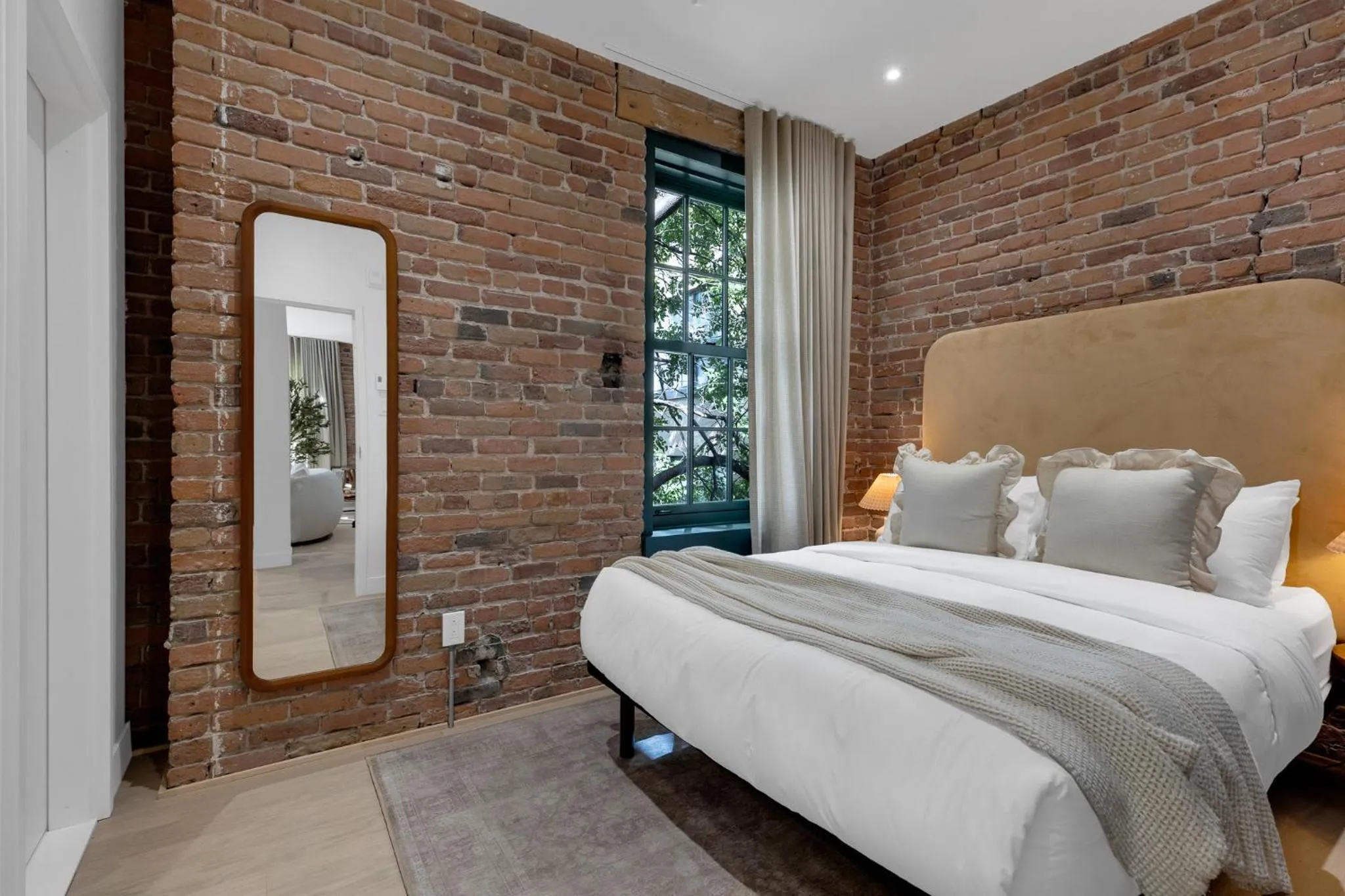 Bed in The Mercer Boutique Hotel