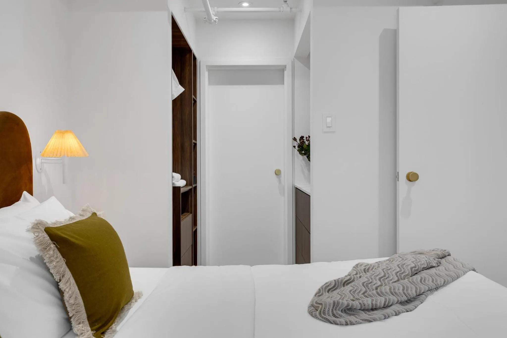 Bed in The Mercer Boutique Hotel