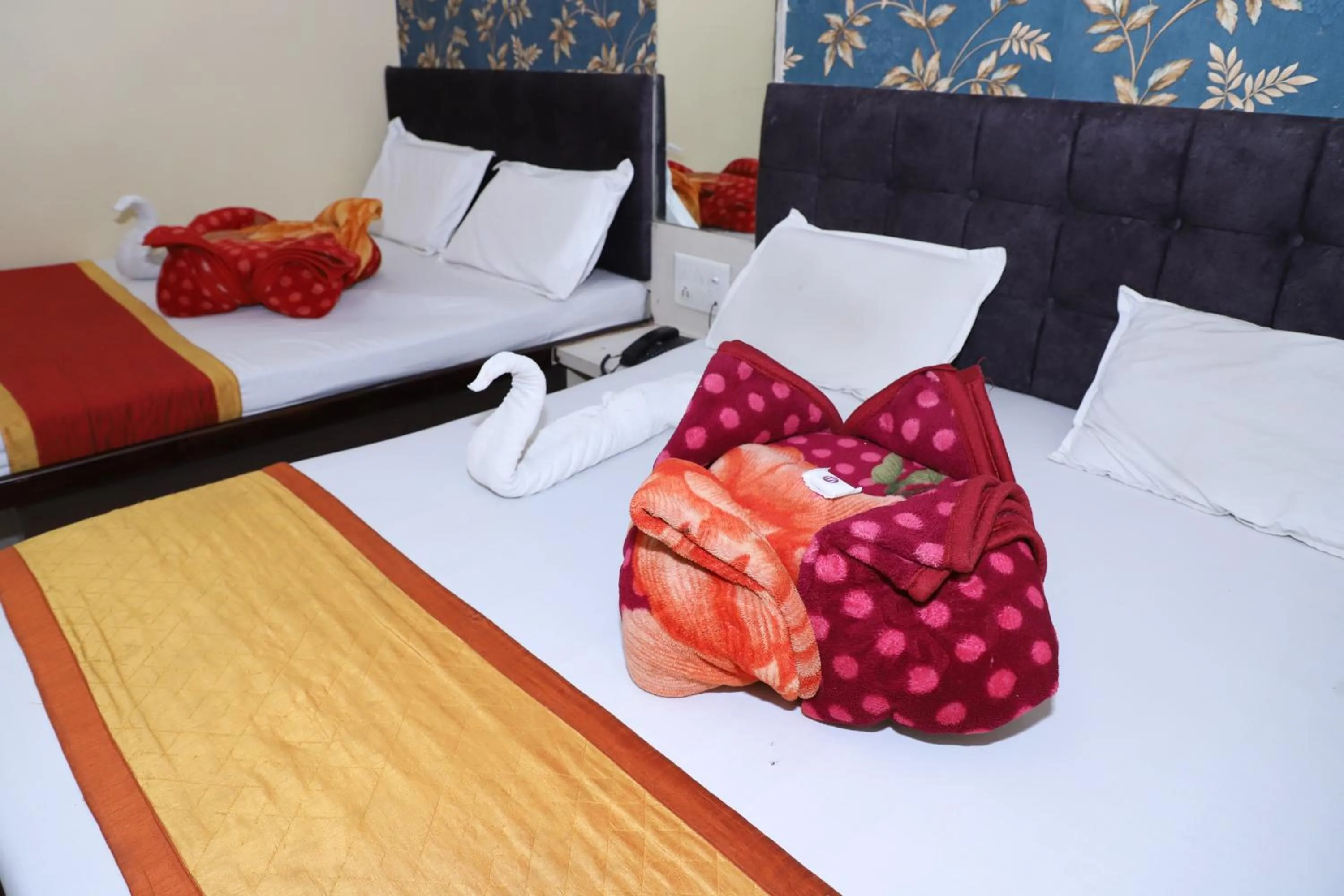 Bed in Hotel Mittal Inn