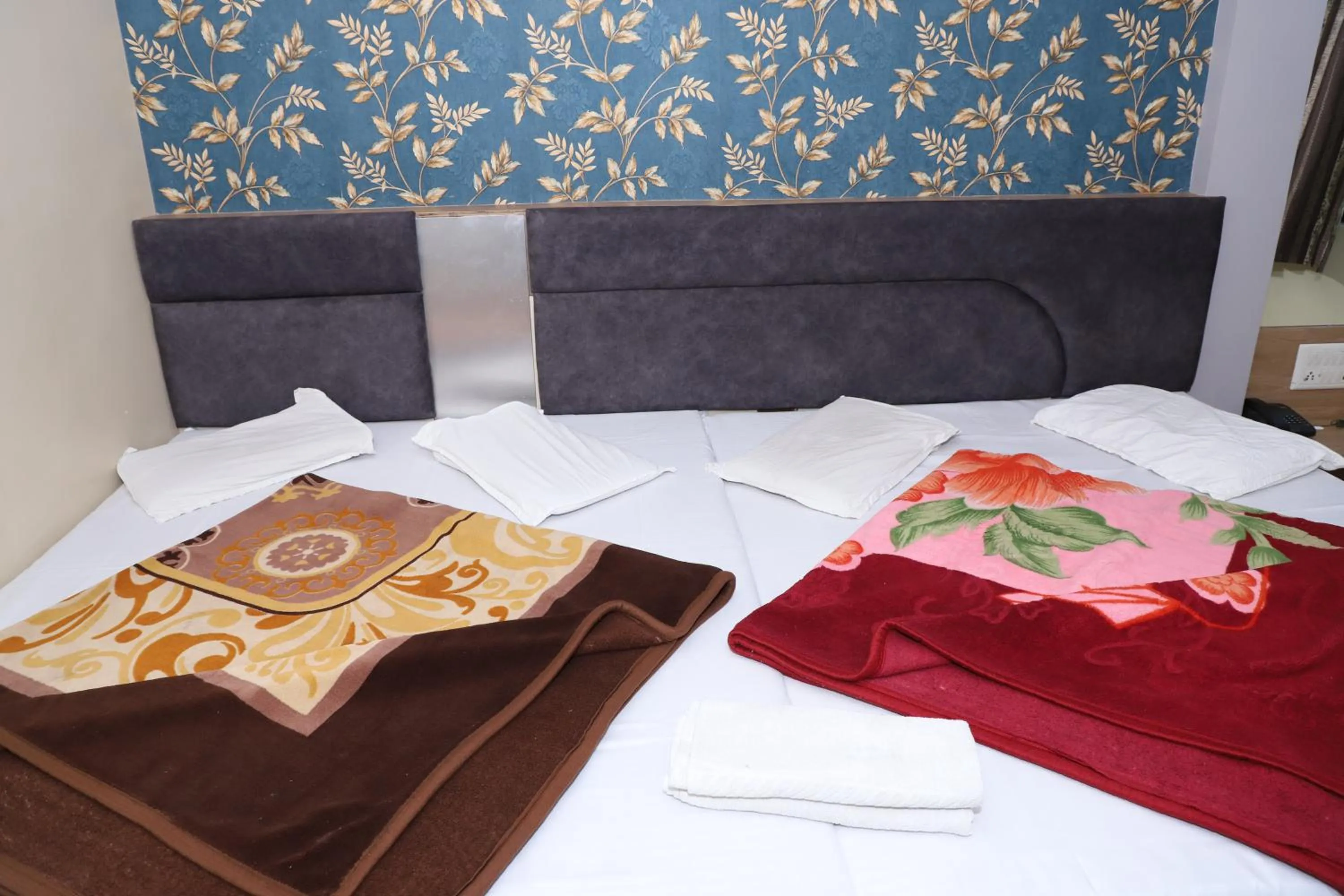 Bed in Hotel Mittal Inn