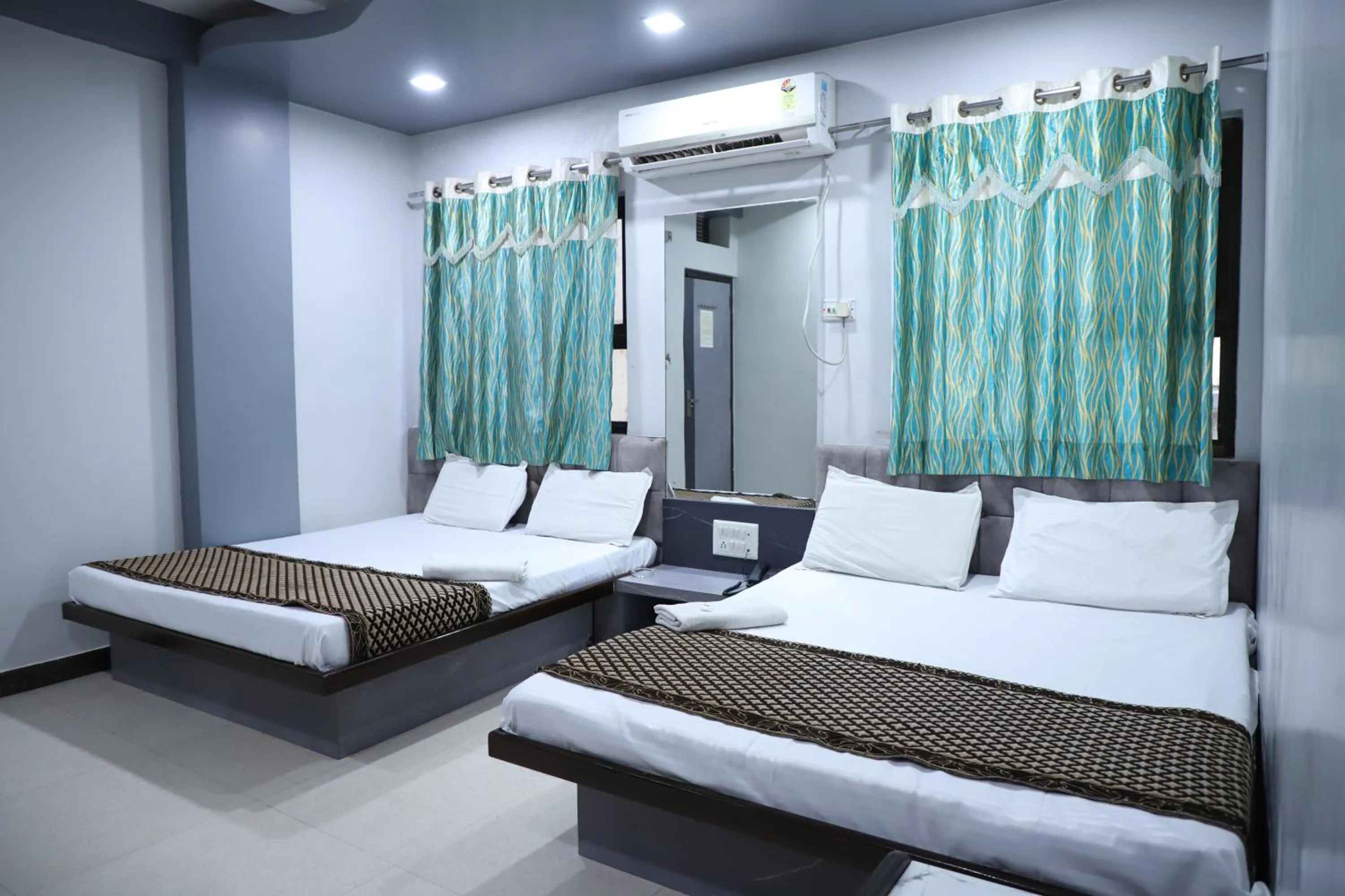 Bed in Hotel Mittal Inn