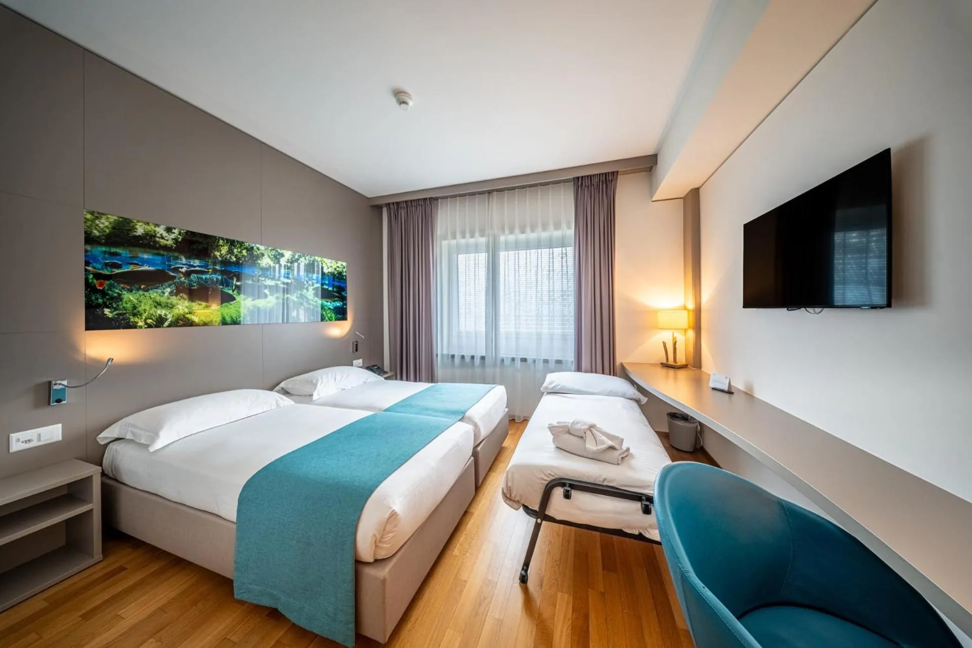 Bed in Aquatis Hotel