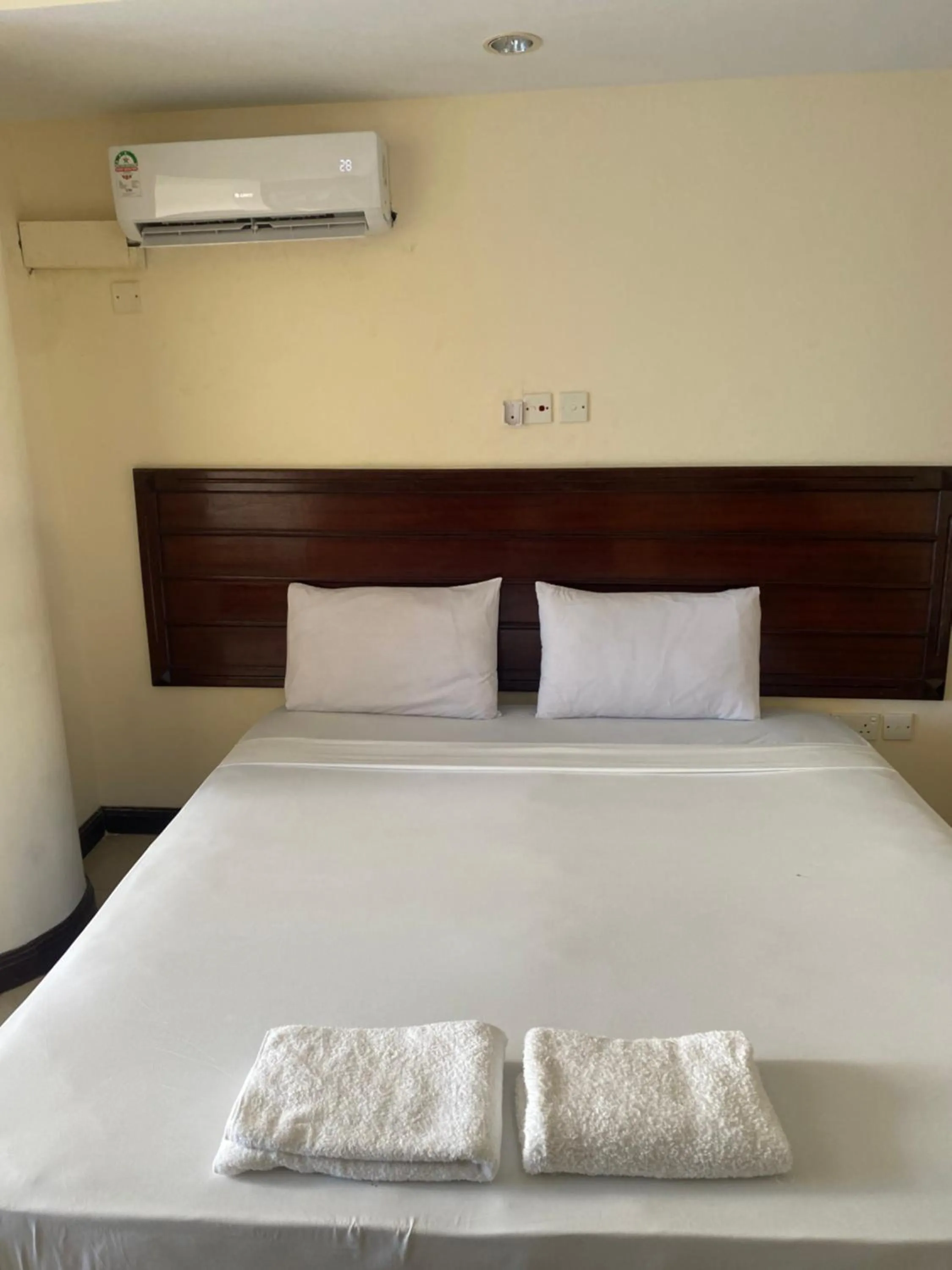 Bed in Sunrise Apartments