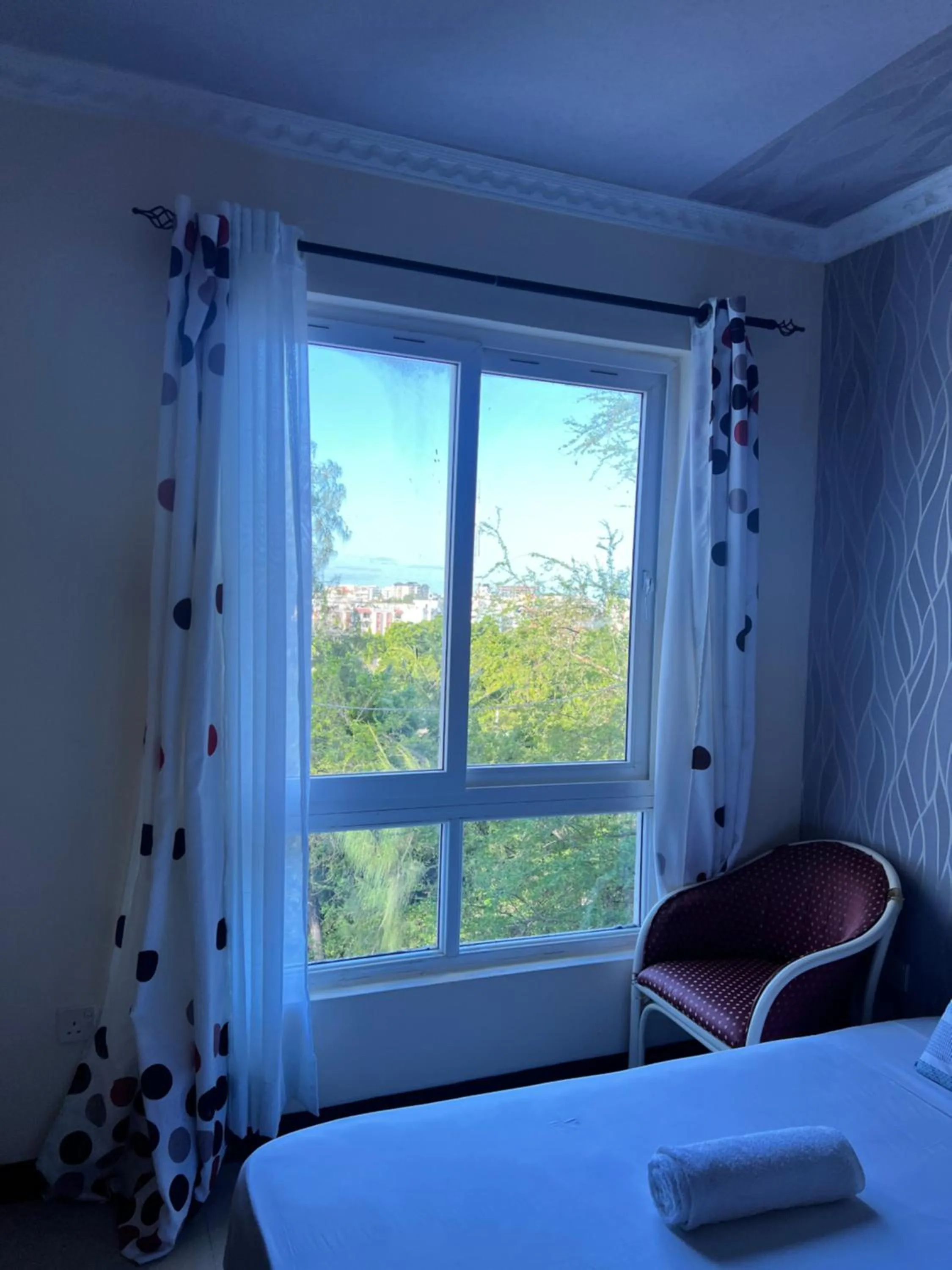 Bed in Sunrise Apartments