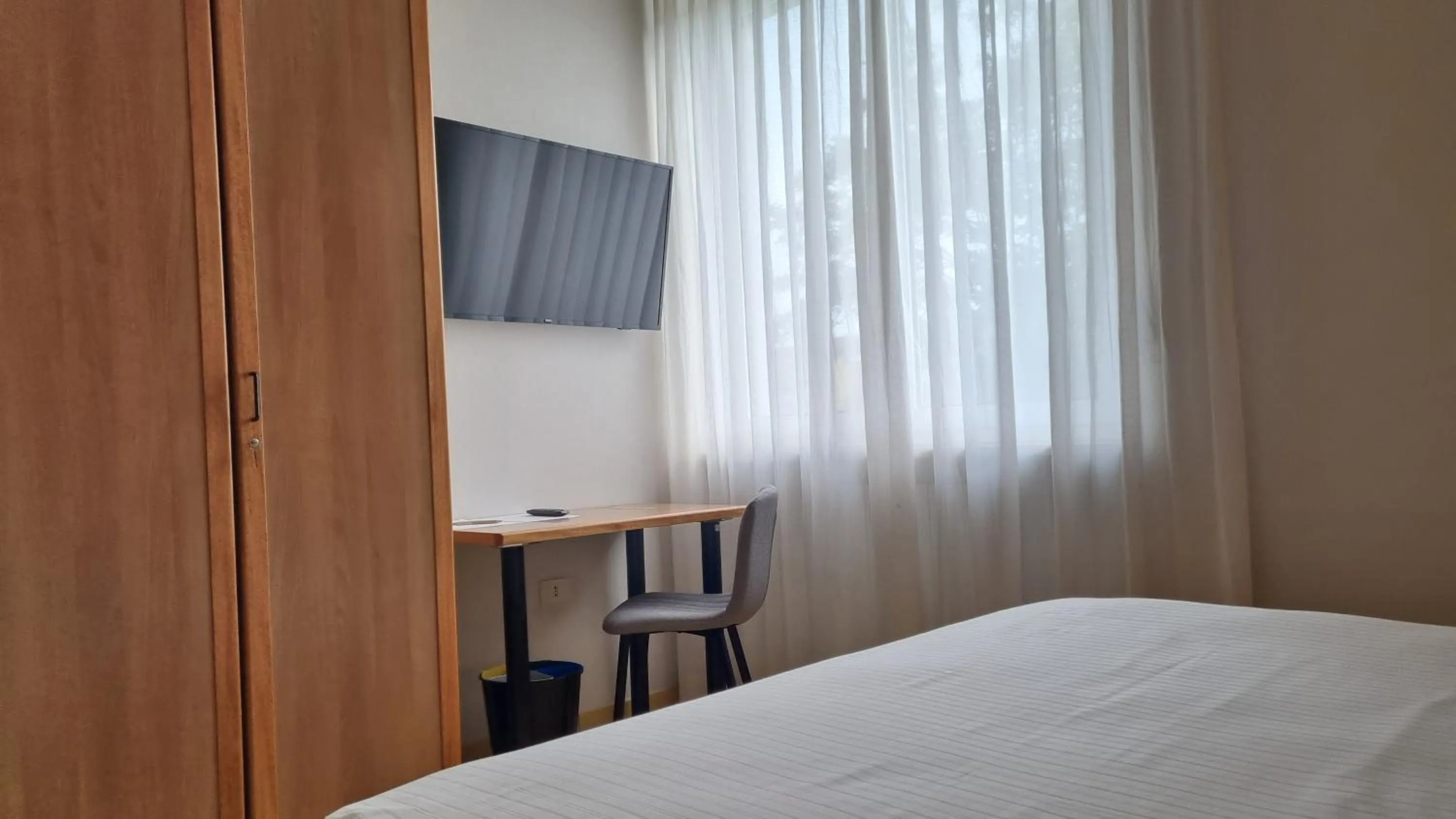 Bed in Phi Hotel Homy Druento