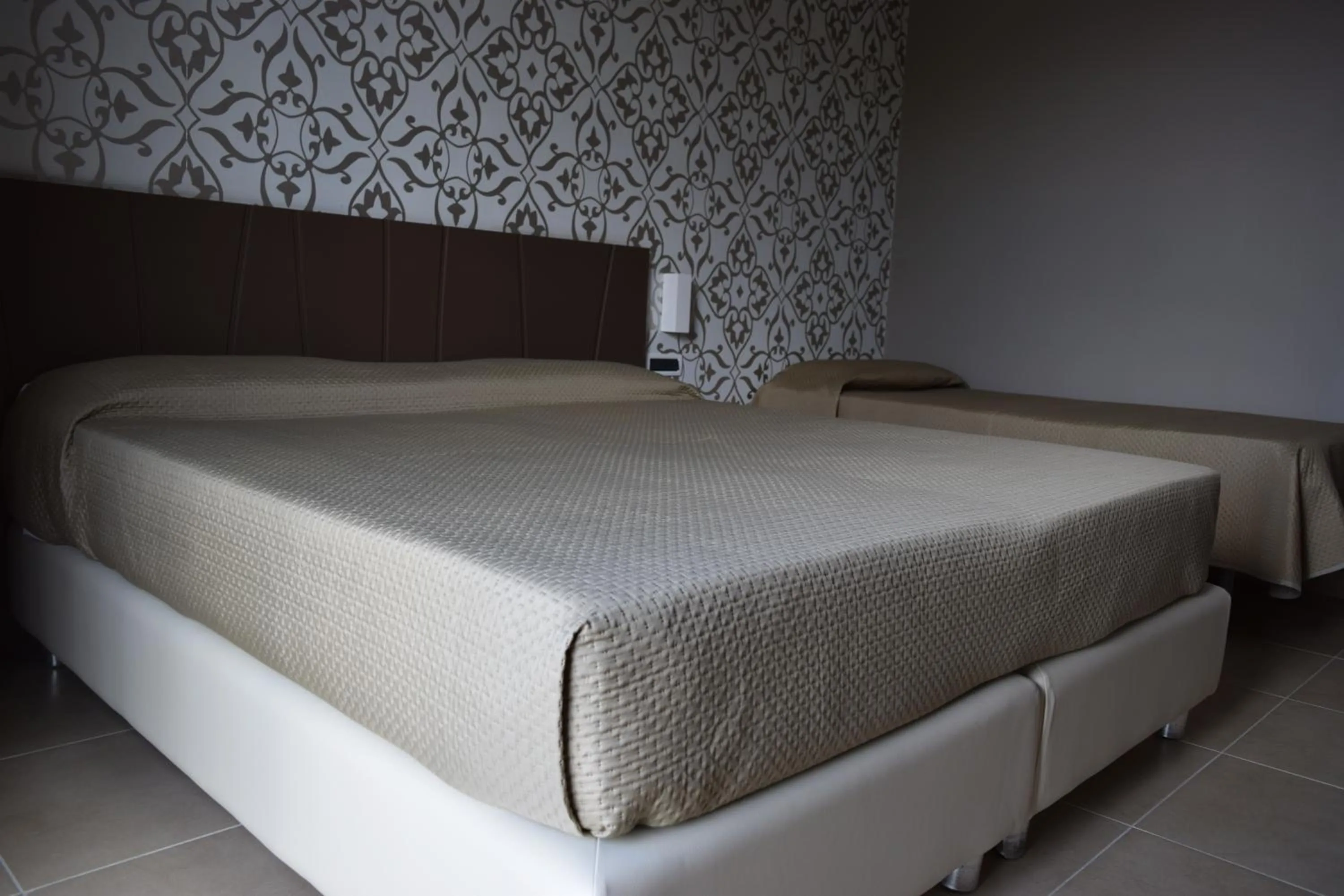 Bed in Sunrise Hotel