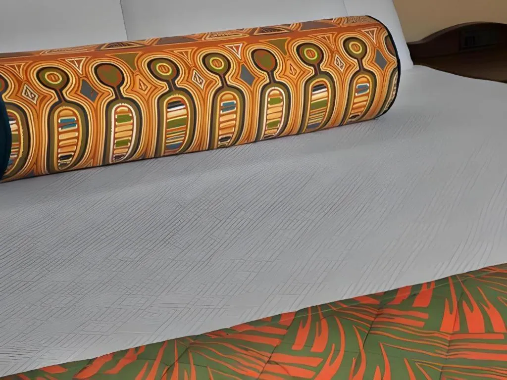 Bed in Disney's Caribbean Beach Resort