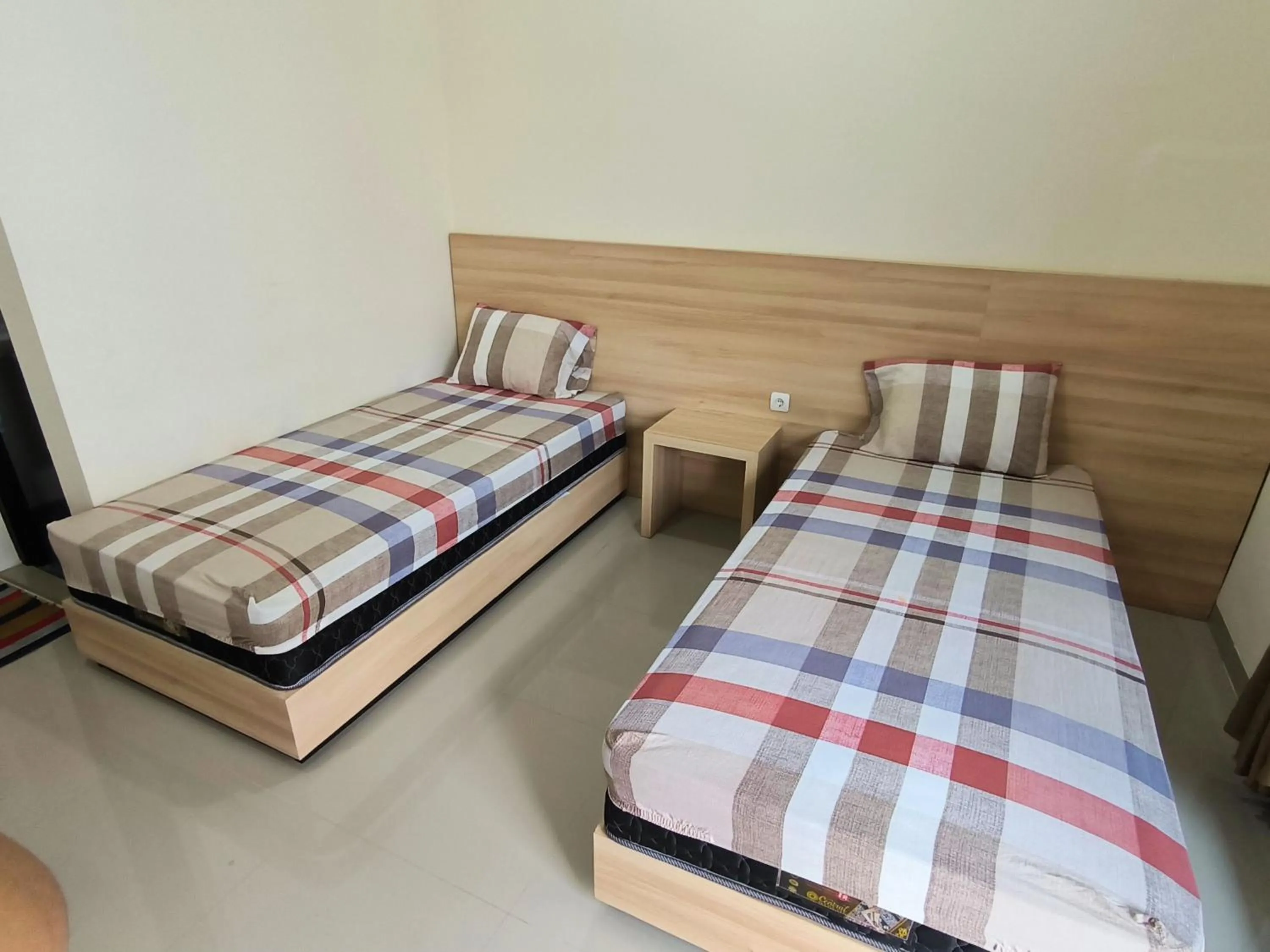 Bed in Tentrem Guesthouse Baru