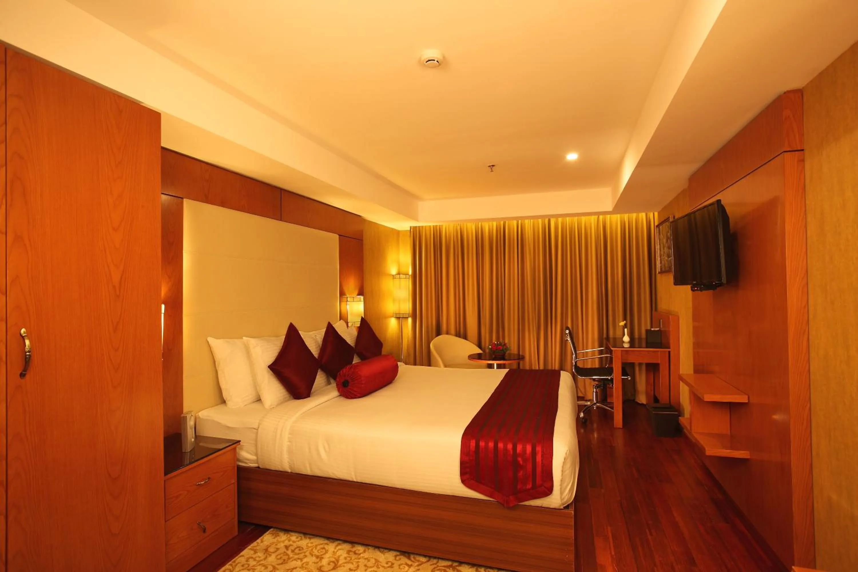 Bed in The Garuda Hotels