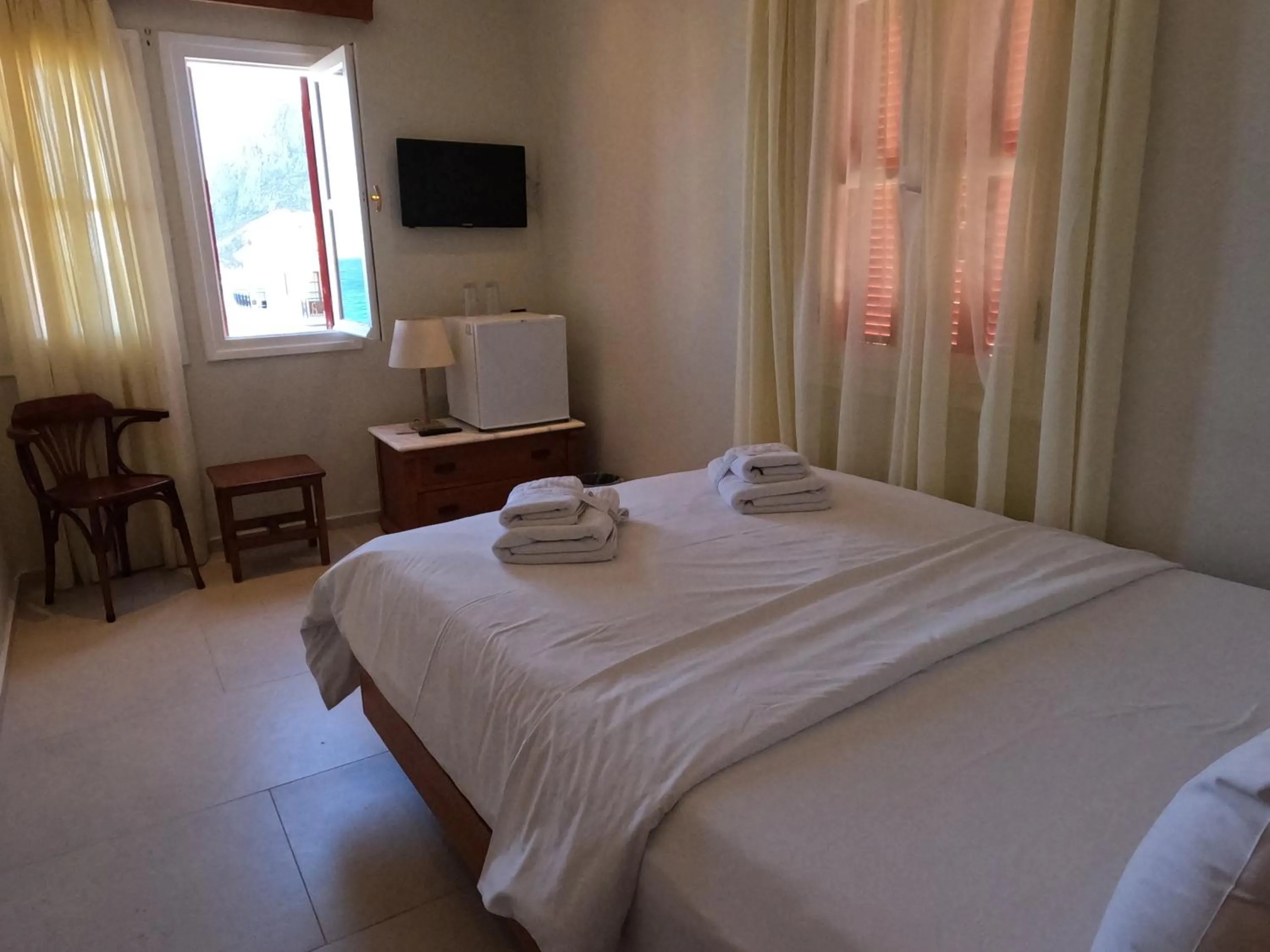 Bed in The Flower Of Monemvasia Hotel