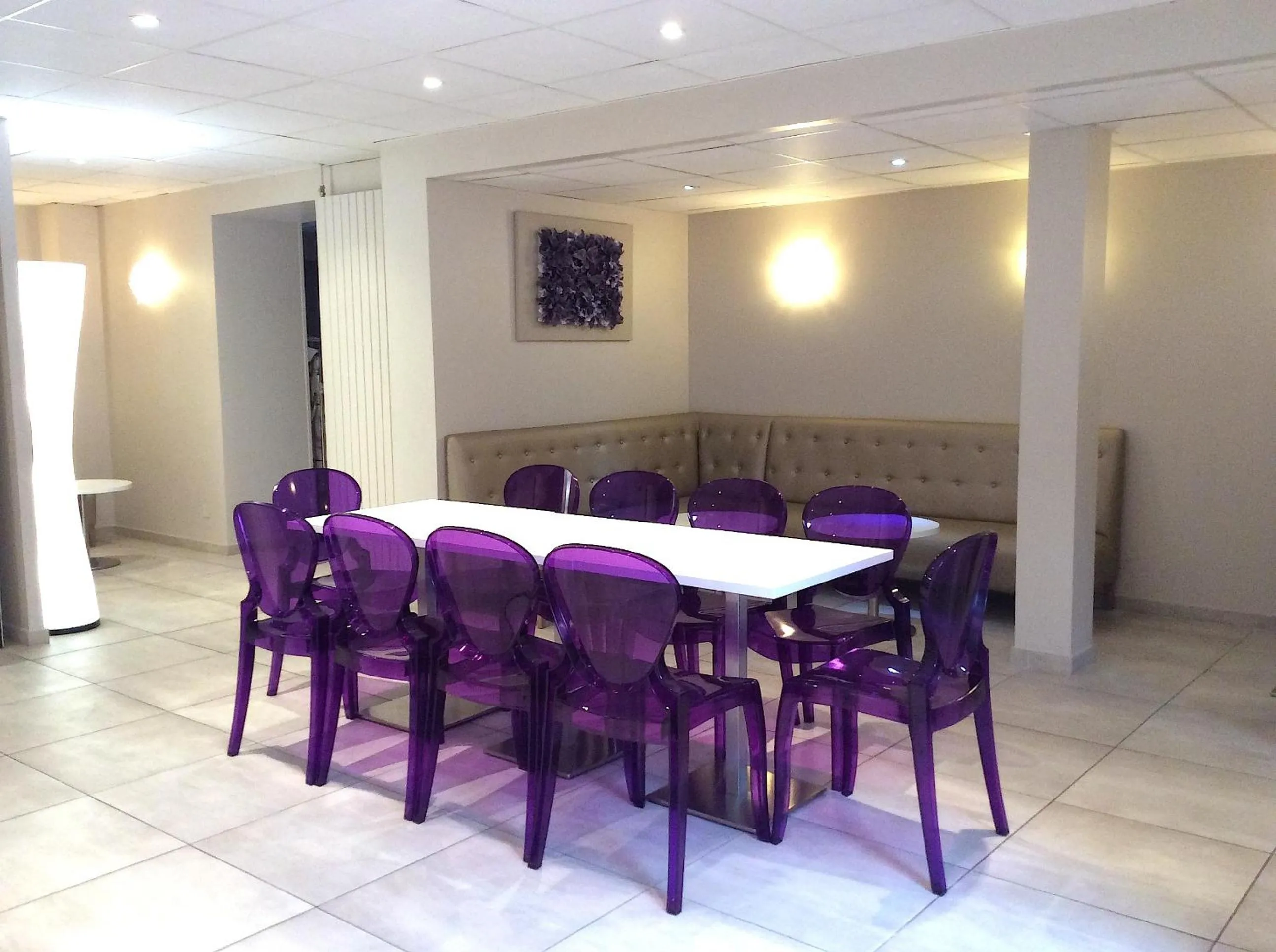 Communal lounge/ TV room in Hôtel Peyramale