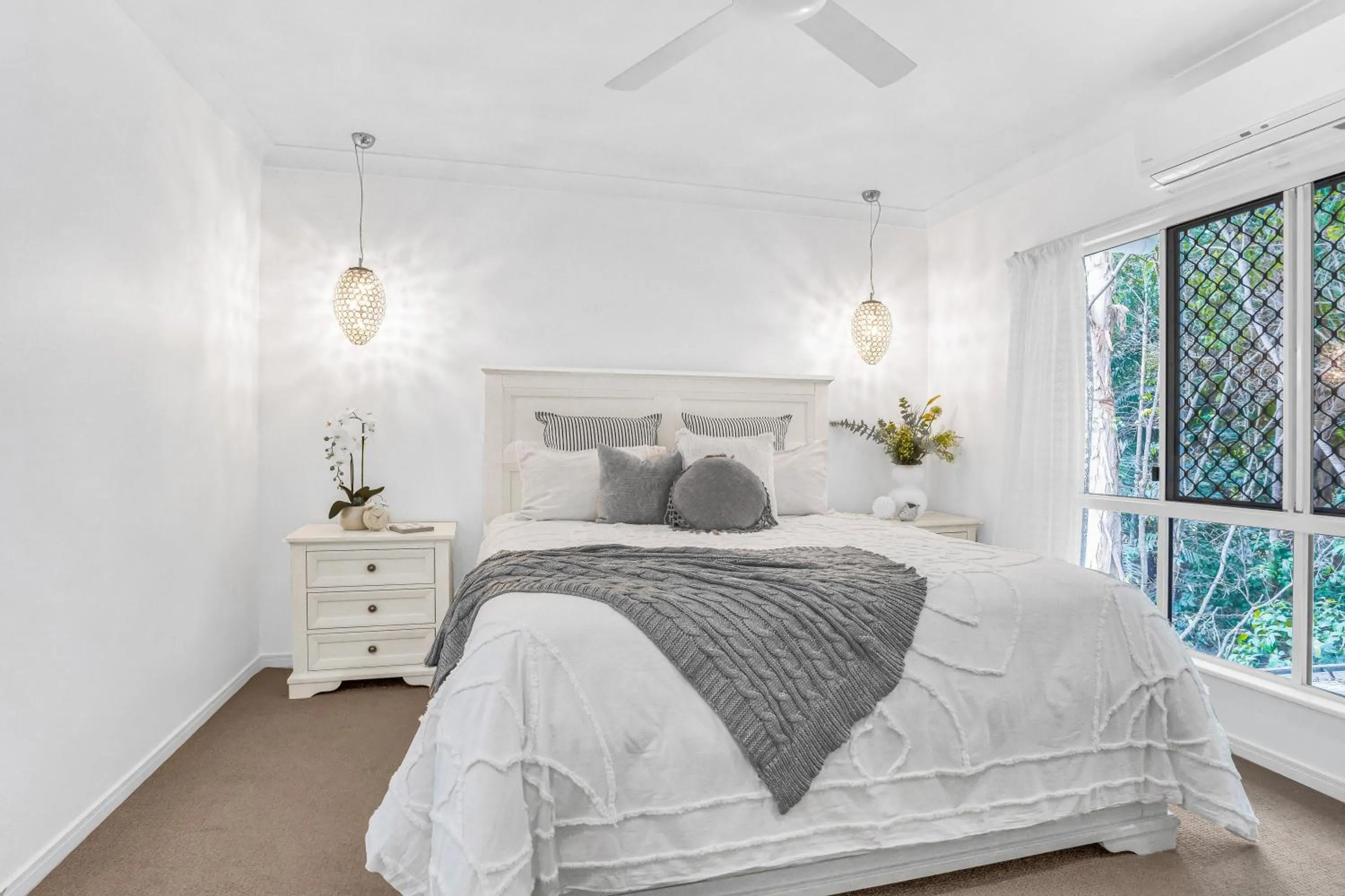 Bed in Palm Cove Studio Apartments