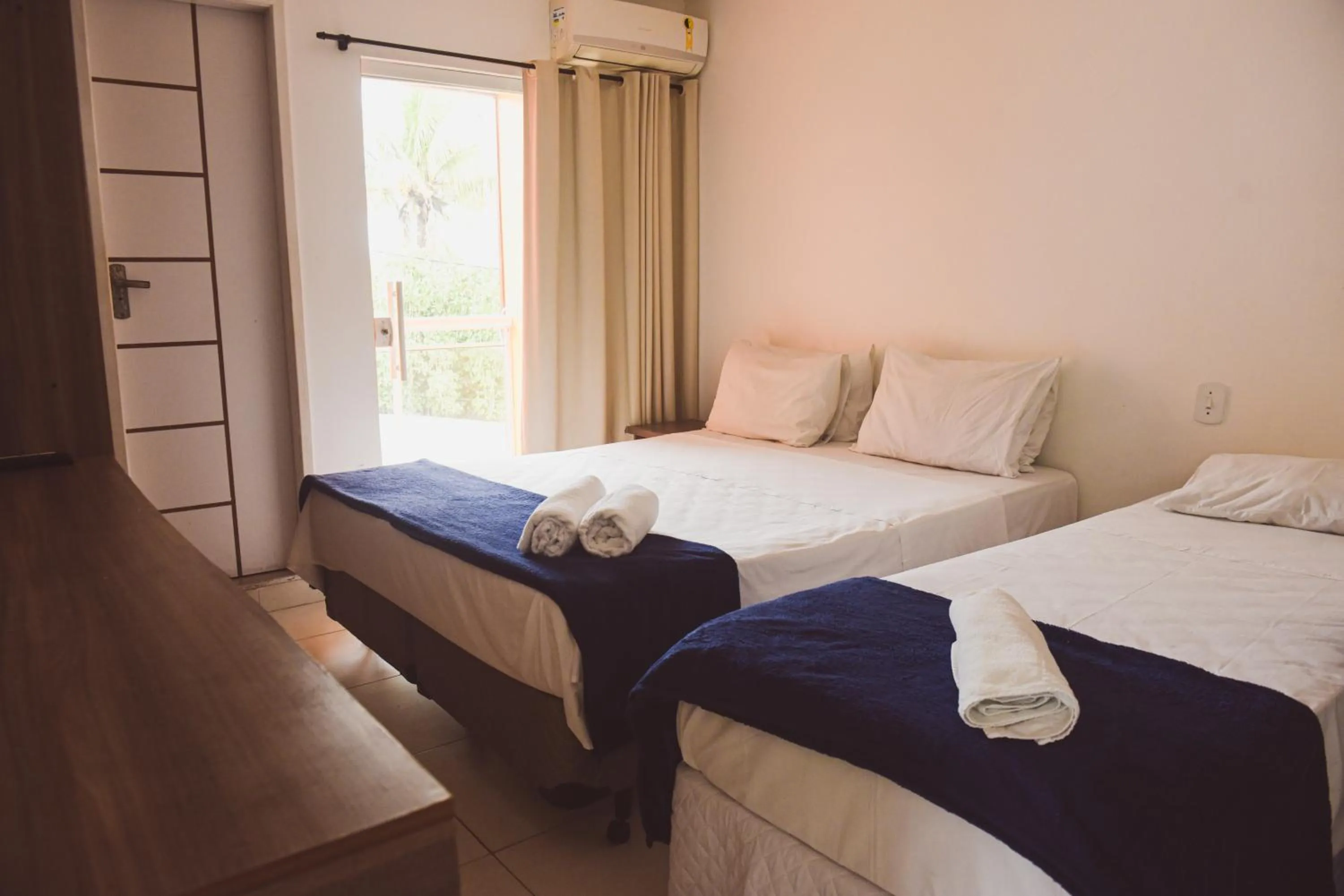 Bed in Pousada Xerxes