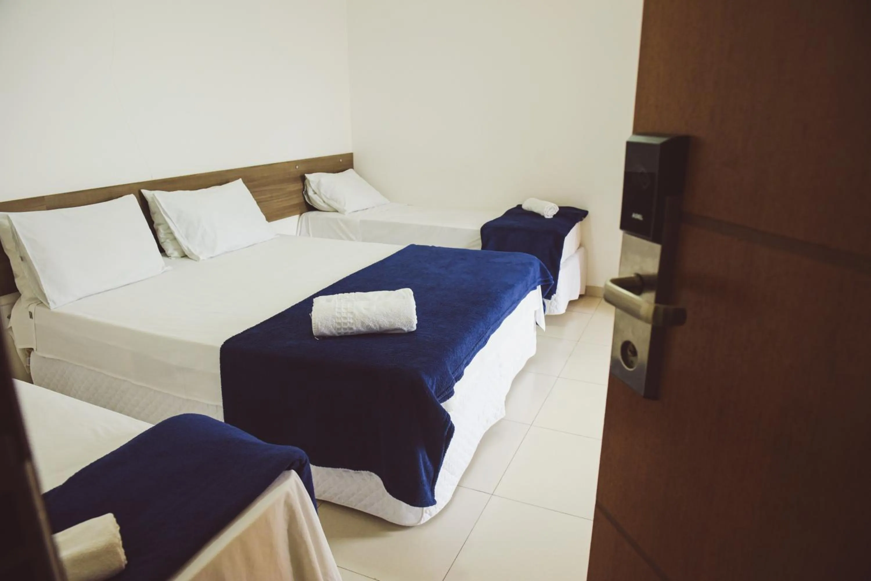 Bed in Pousada Xerxes