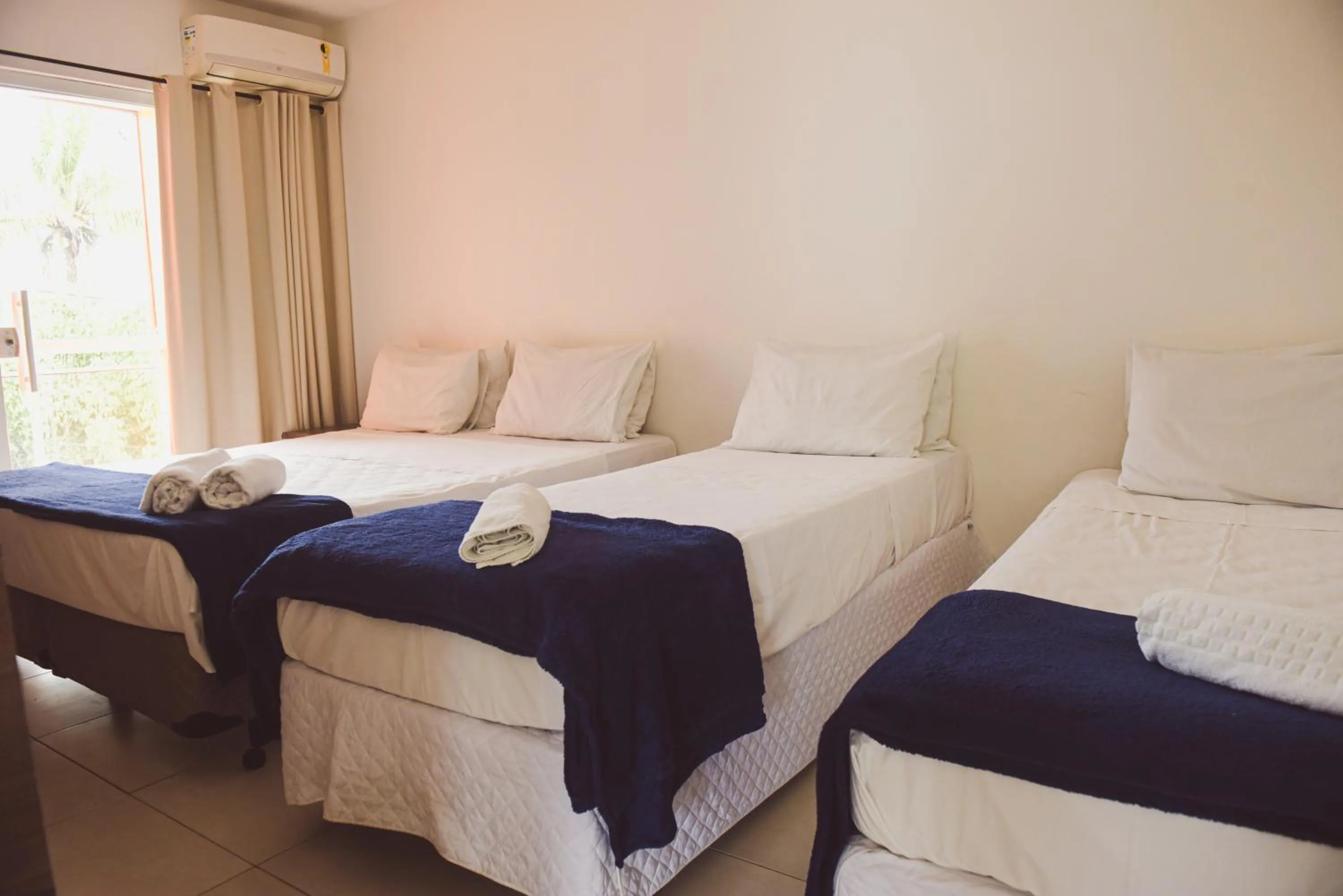 Bed in Pousada Xerxes