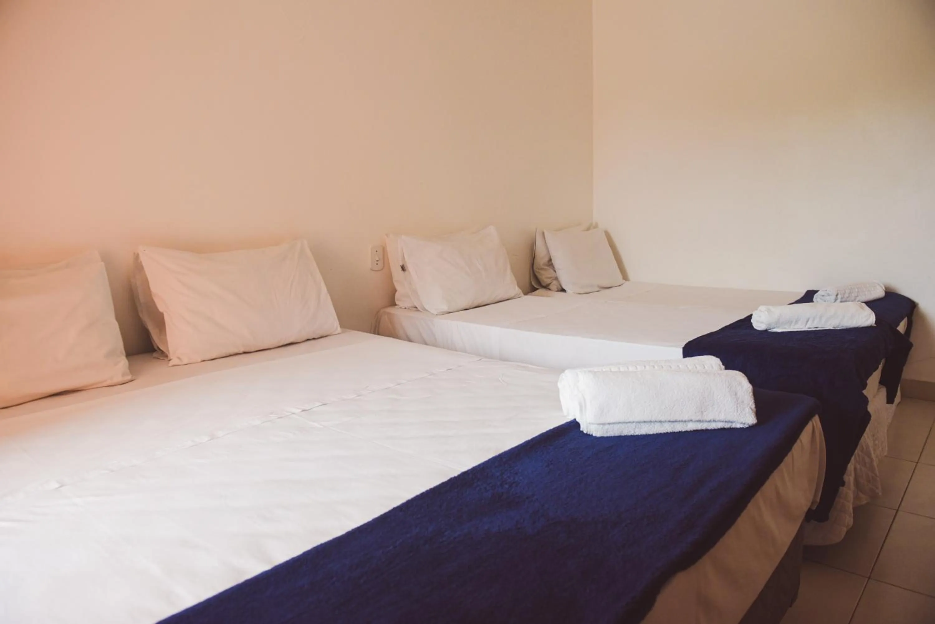 Bed in Pousada Xerxes