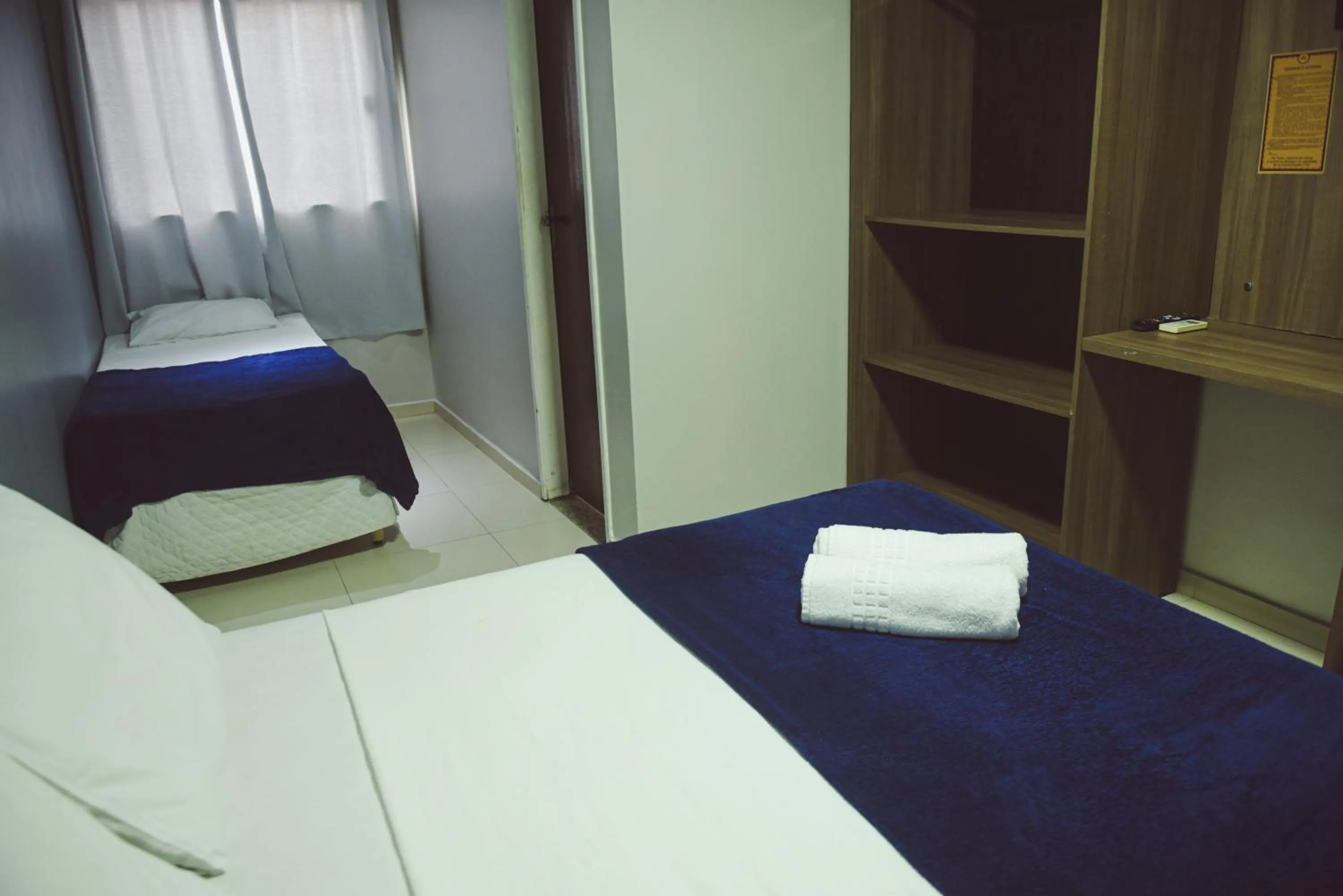 Bed in Pousada Xerxes