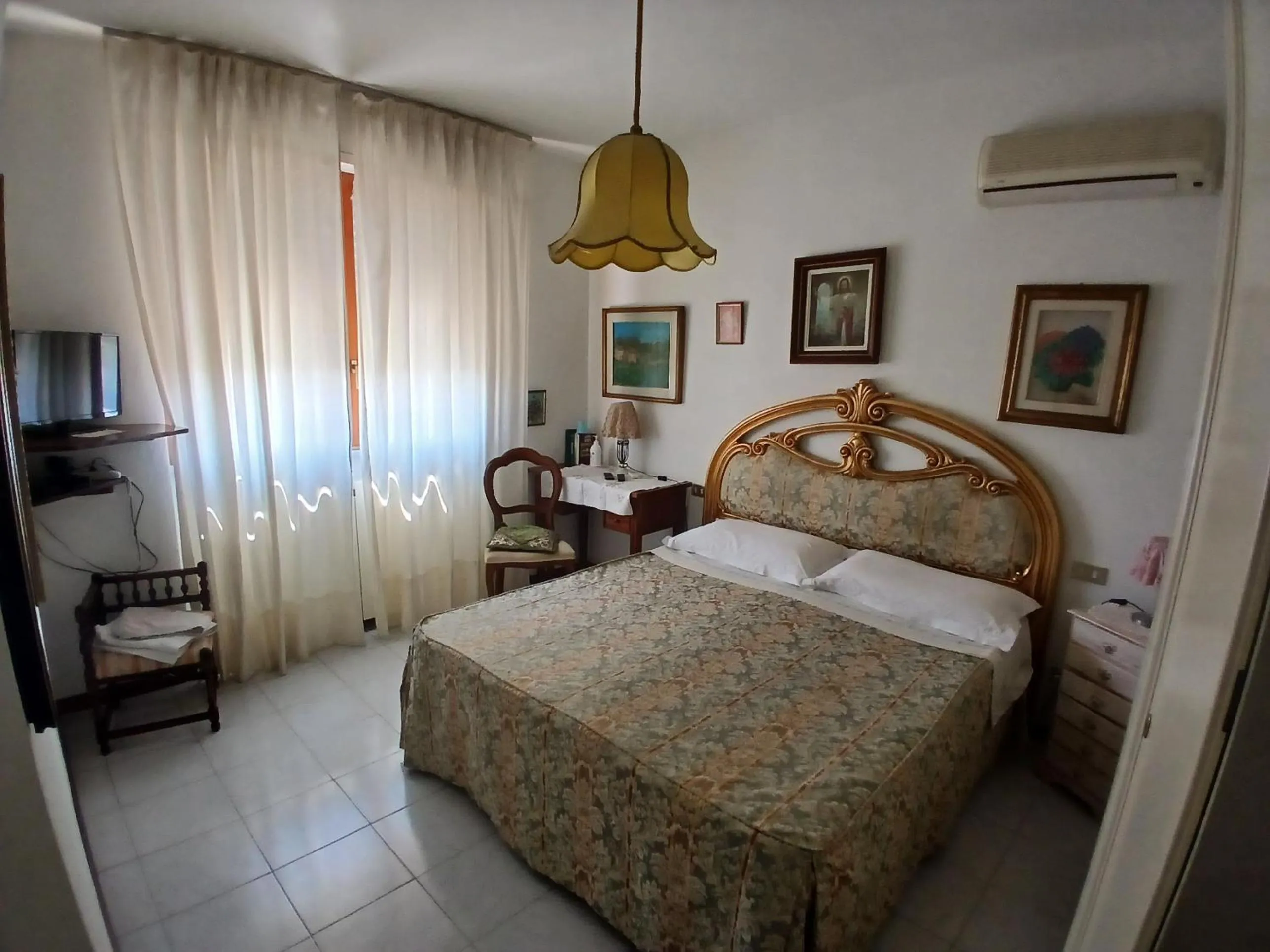 Bed in Il Melograno B&B with private bathrooms