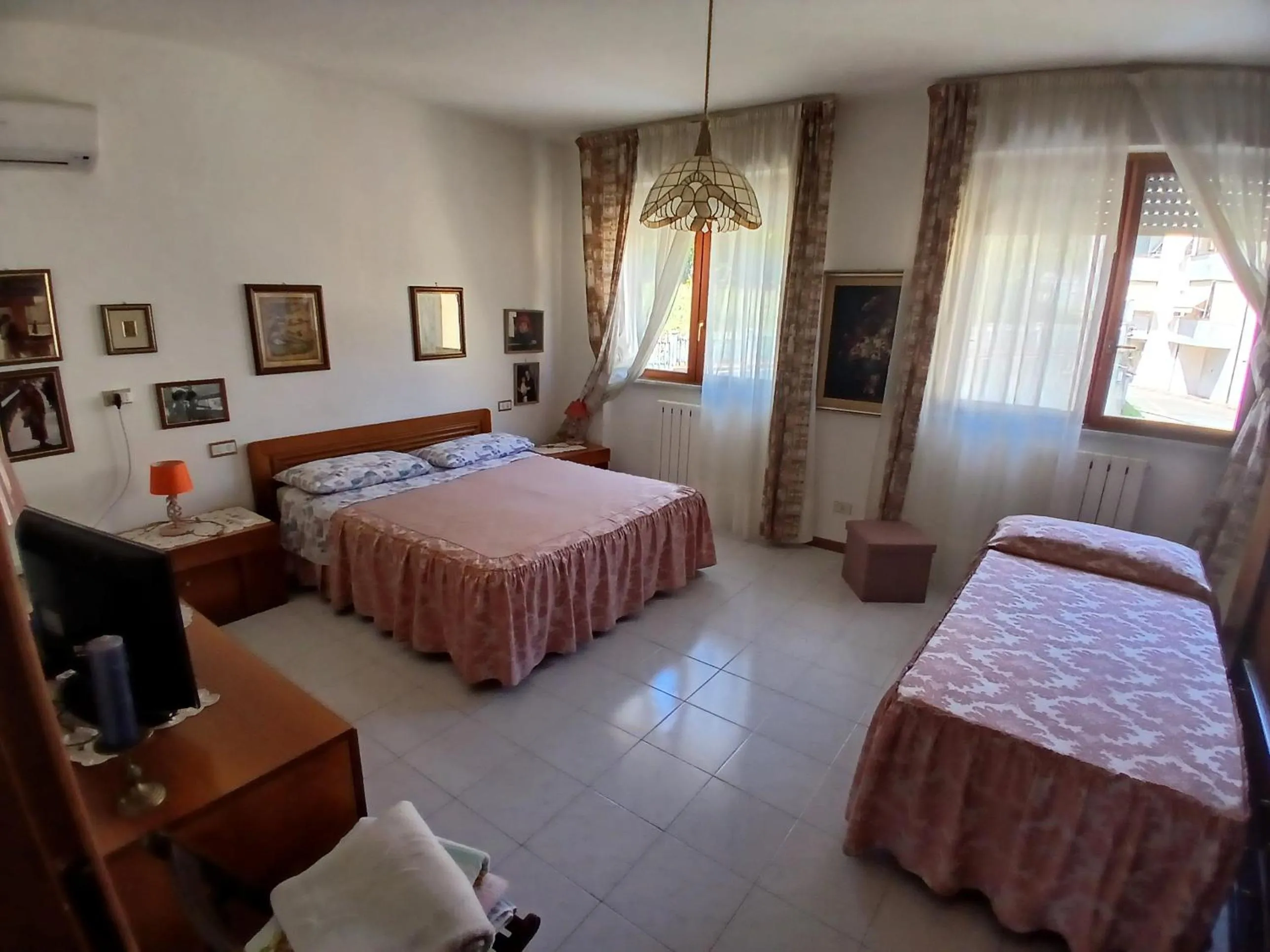 Bed in Il Melograno B&B with private bathrooms