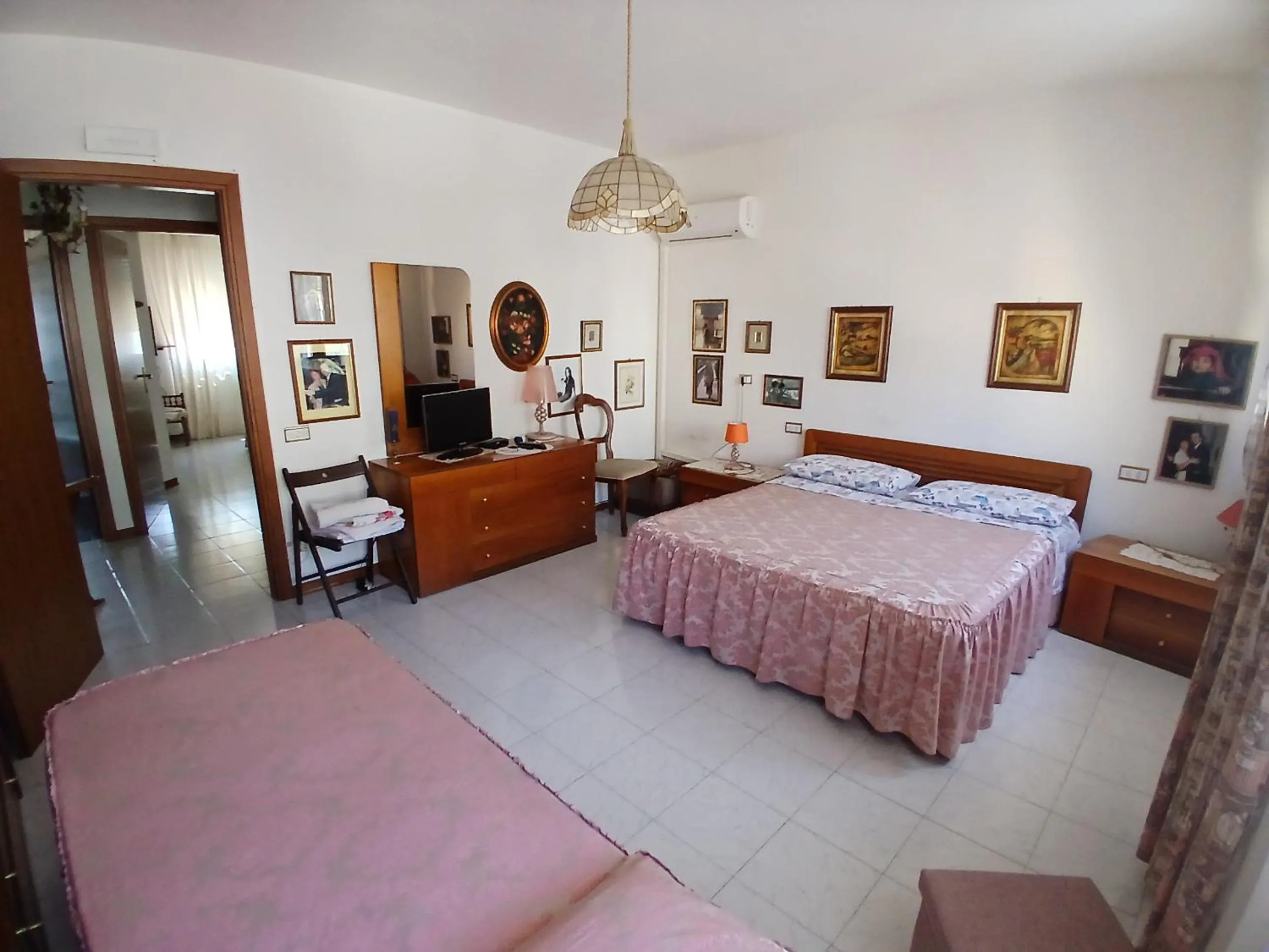 Bed in Il Melograno B&B with private bathrooms