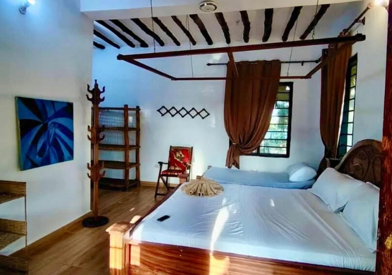 Bed in The Tropinest bungalow