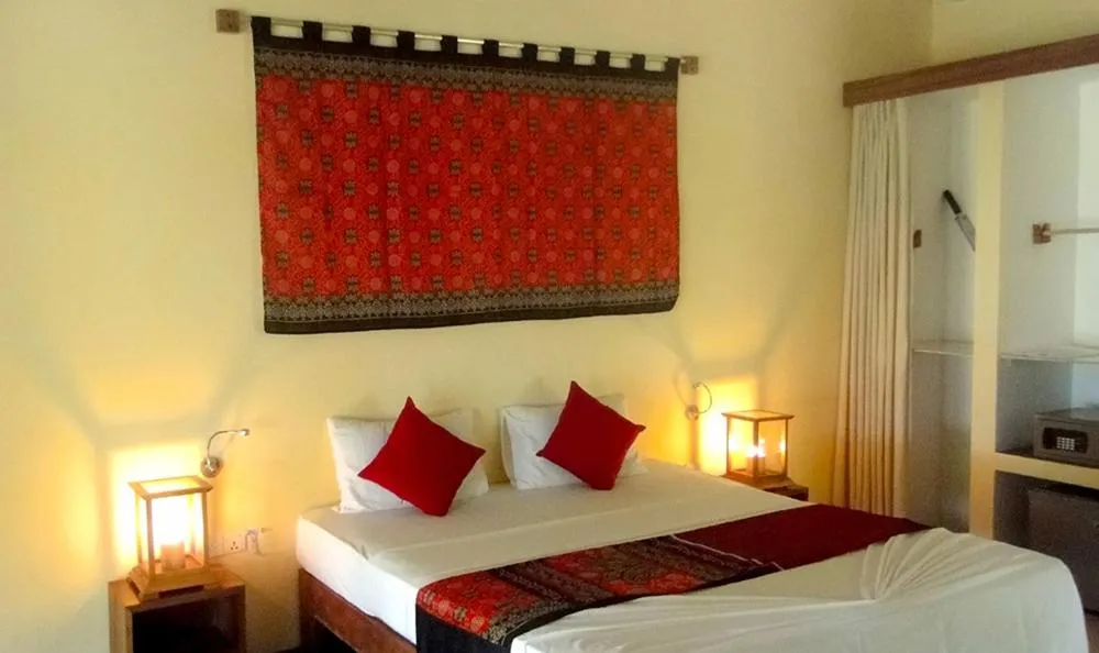 Bed in Giman Free Beach Resort Pasikuda