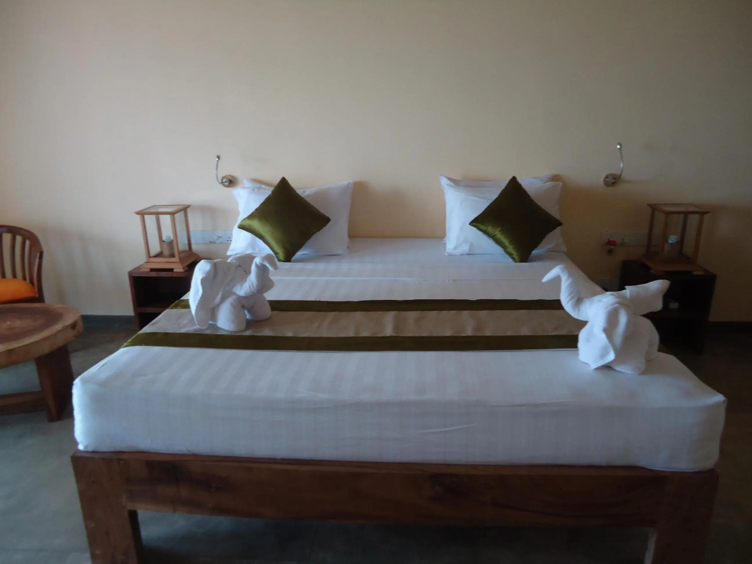 Bed in Giman Free Beach Resort Pasikuda