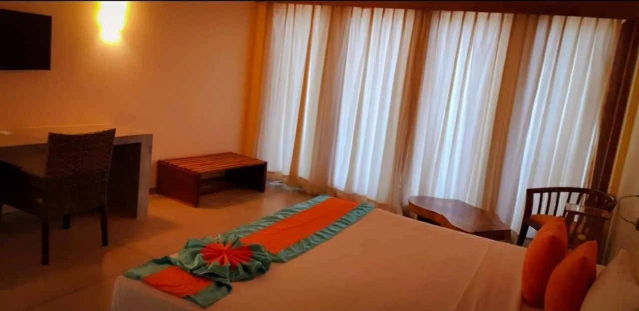 Bed in Giman Free Beach Resort Pasikuda