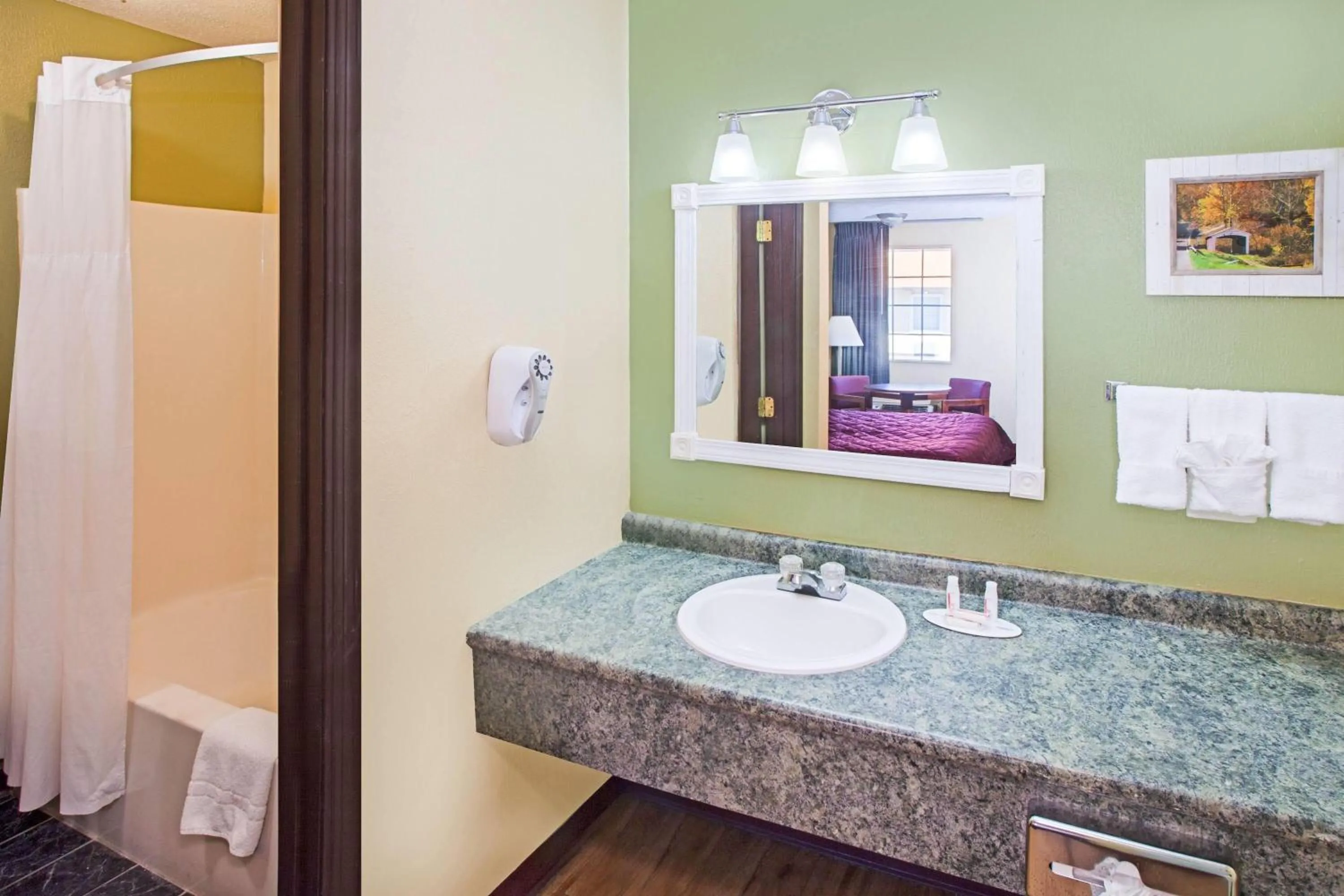 Bathroom in Days Inn & Suites by Wyndham Terre Haute