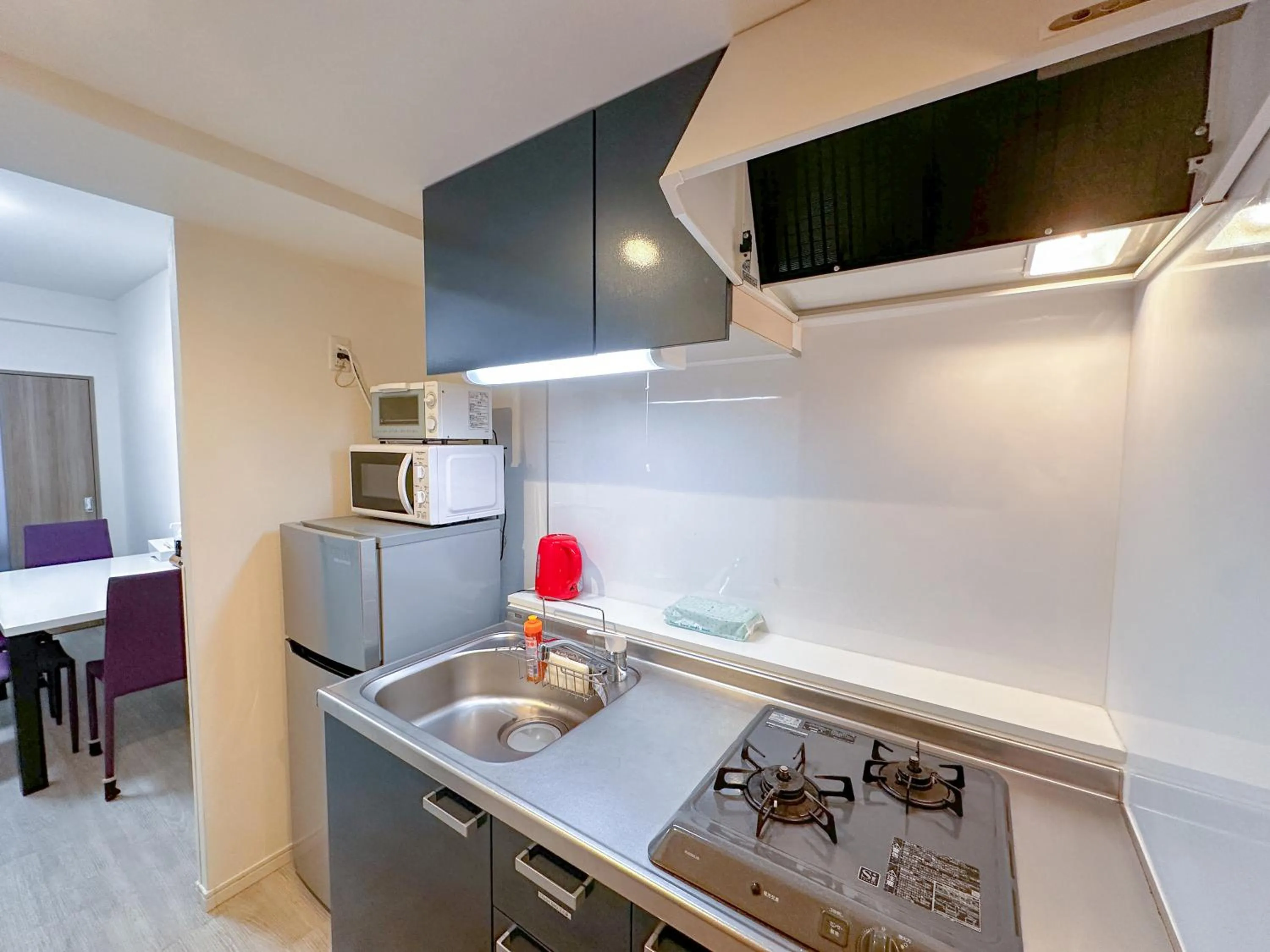 Kitchen or kitchenette in Legatio HAKATA Station East