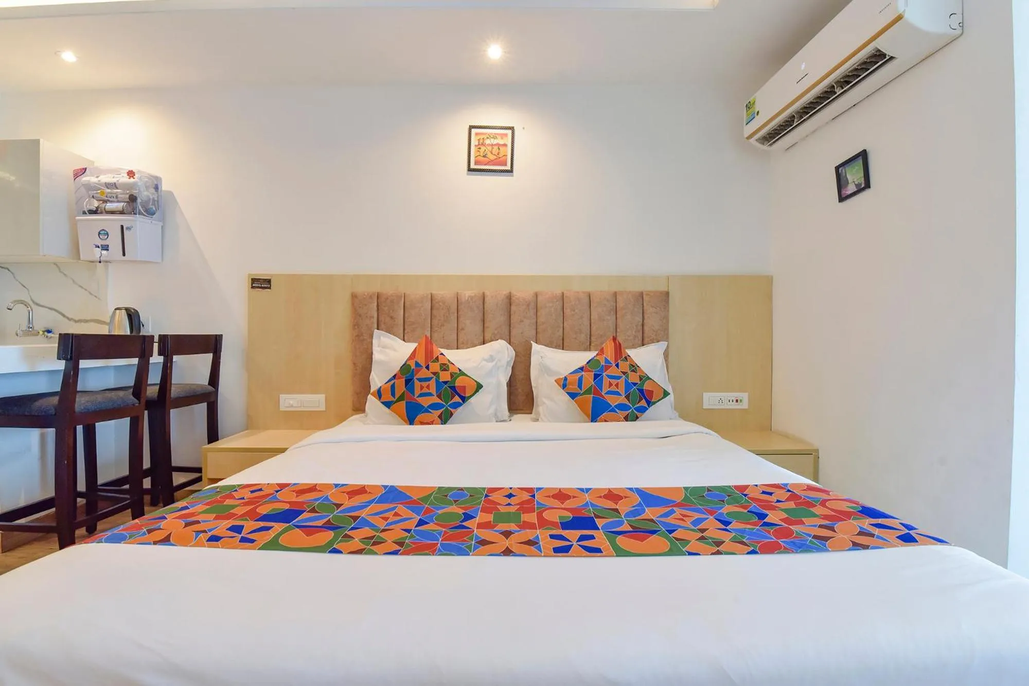 Bed in FabHotel Anukampa With Swimming Pool
