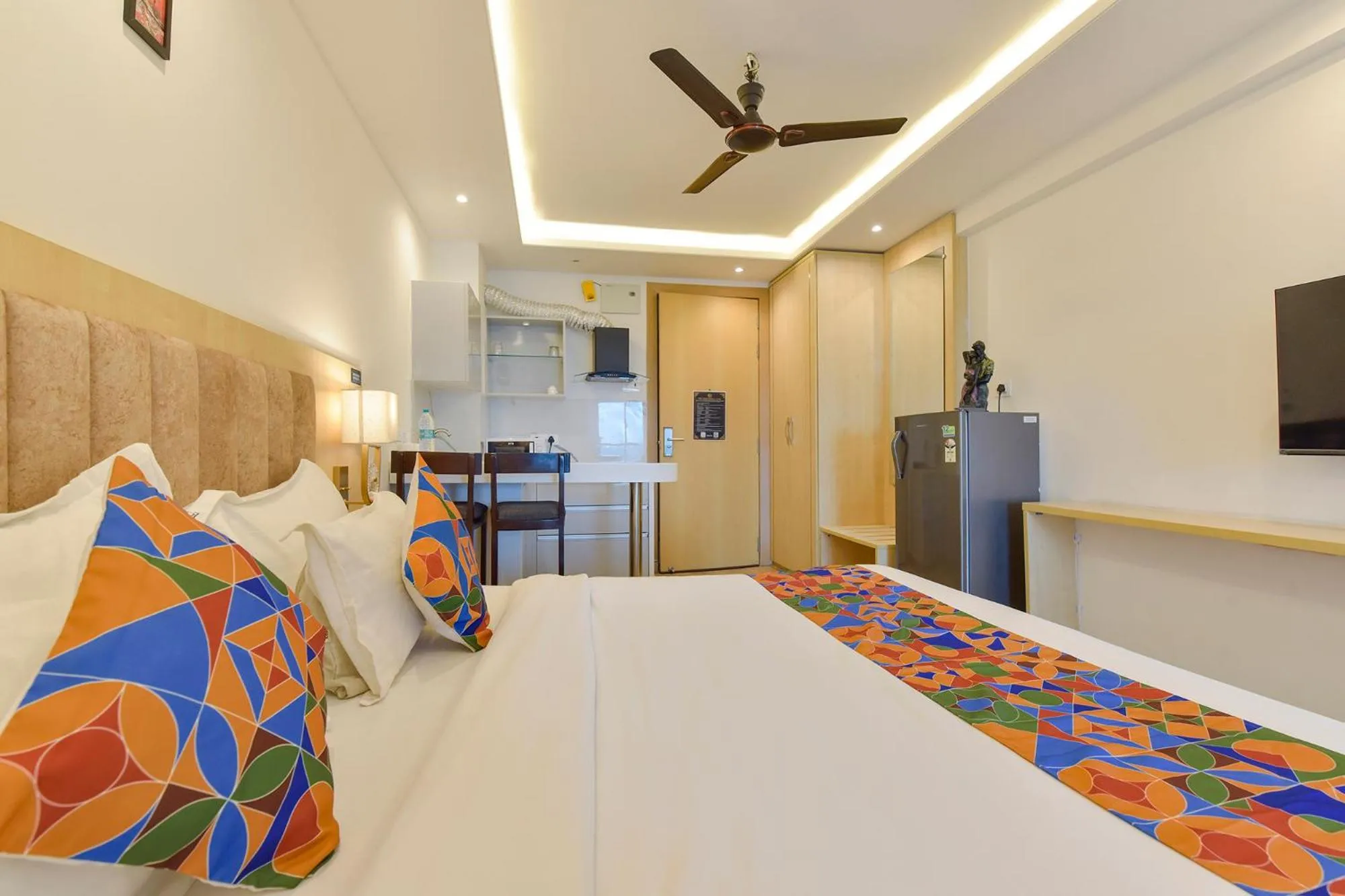 Bed in FabHotel Anukampa With Swimming Pool