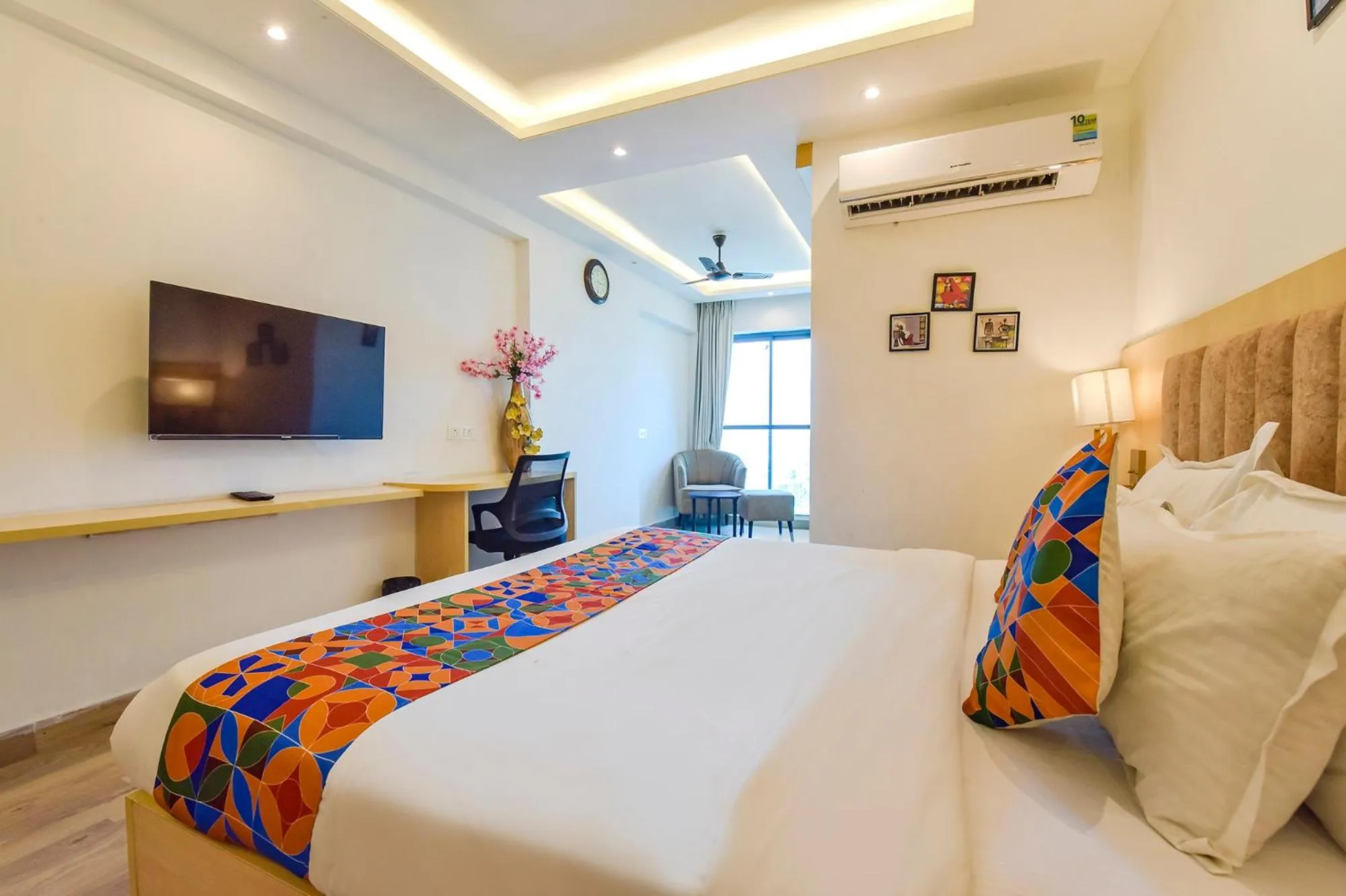 Bed in FabHotel Anukampa With Swimming Pool
