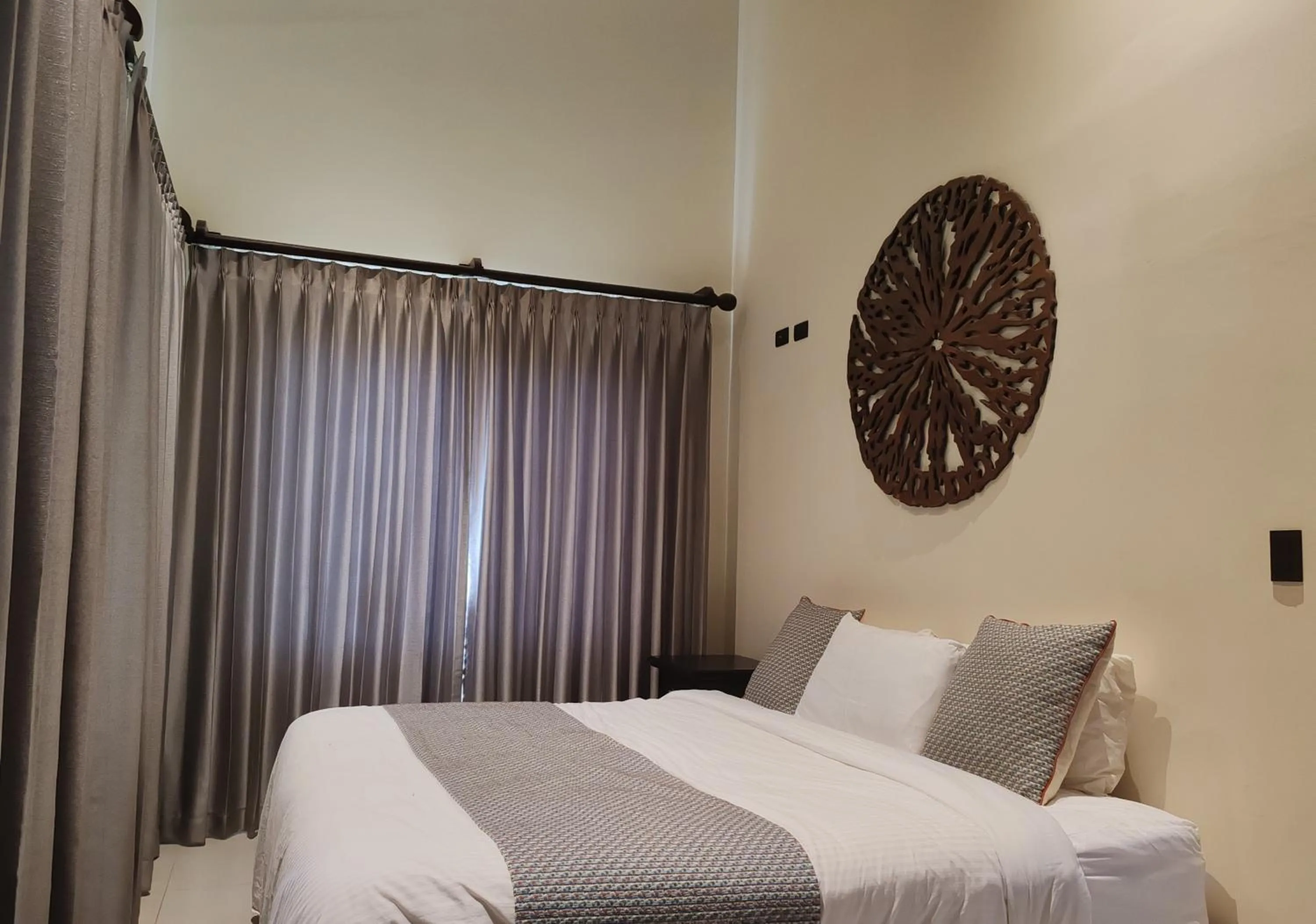 Bed in Marenaz Oceanfront Resort